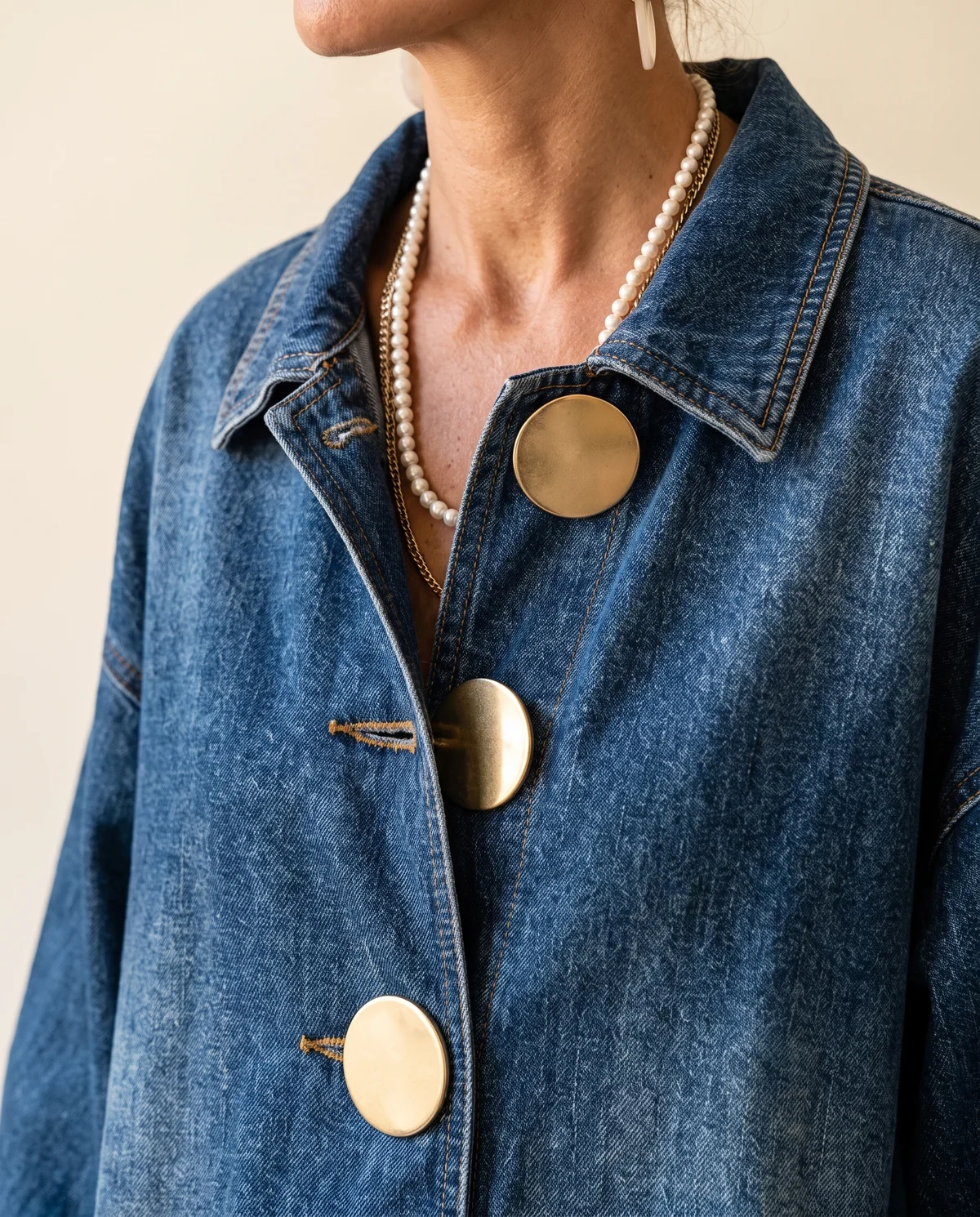 Denim Jacket with Large Gold Buttons in Mid Blue, close-up of the detail