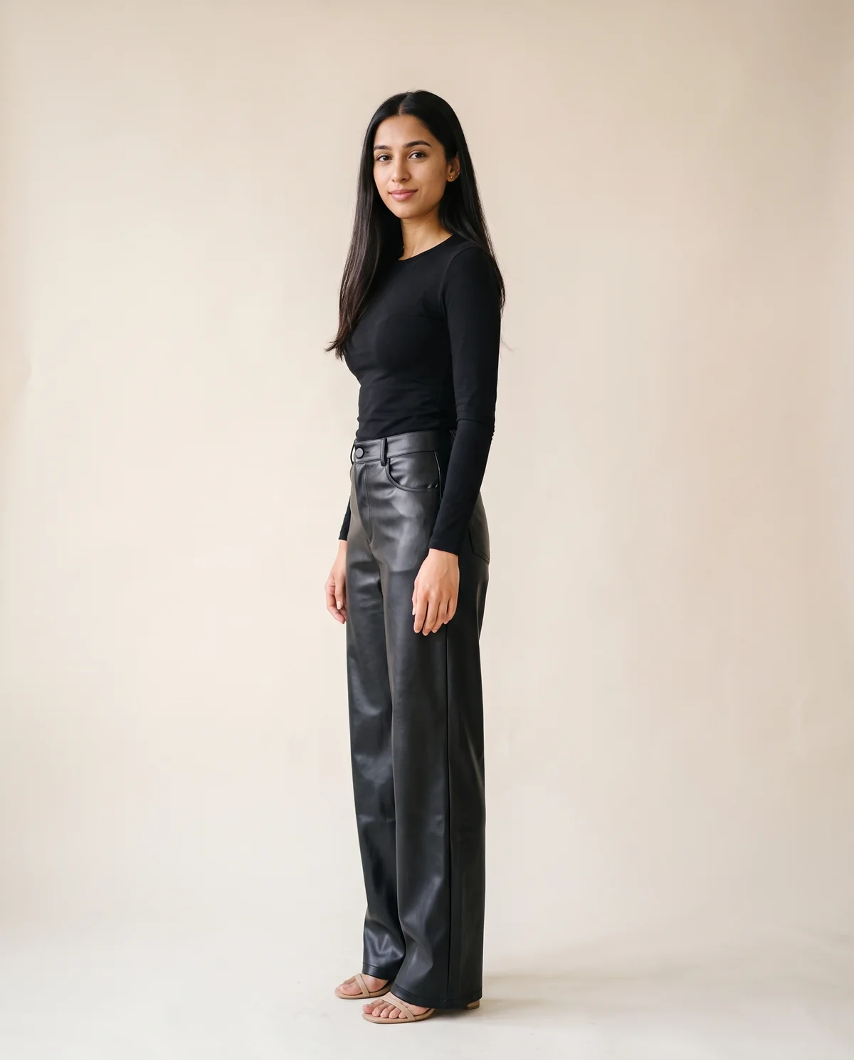 Faux Leather Wide-Leg Trousers in Black, side view, worn by Priya