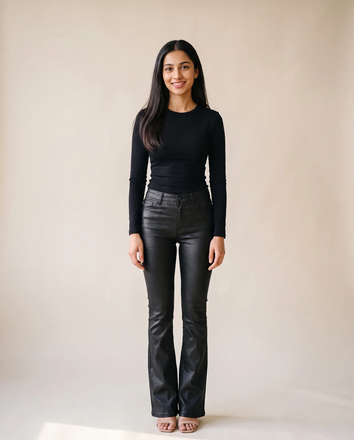 Coated Flare Trousers in Black, front view, worn by Priya