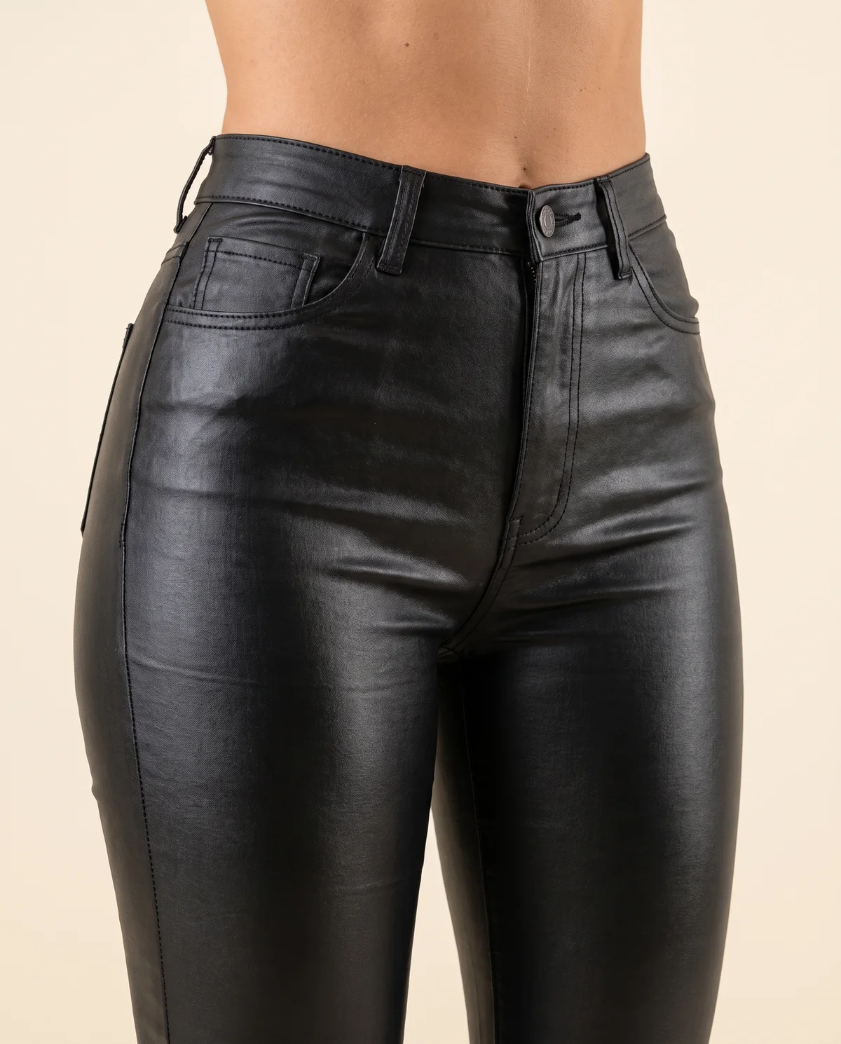 Coated Flare Trousers in Black, close-up of the detail