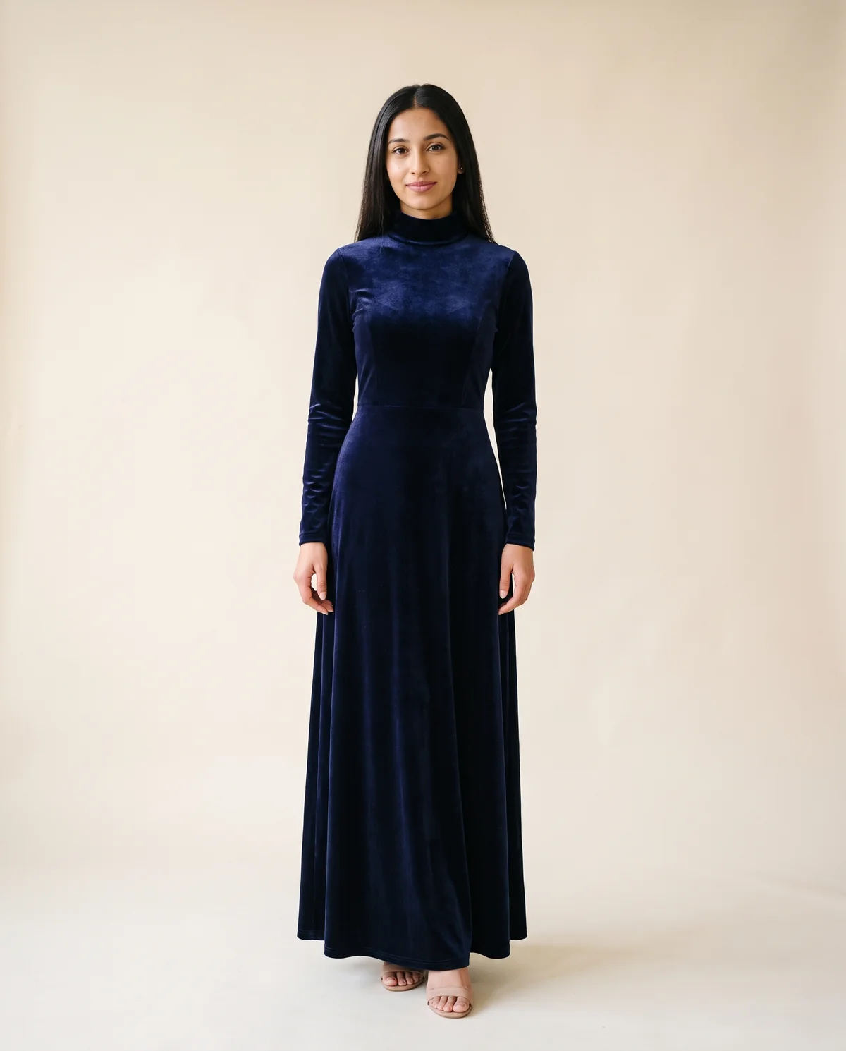 Velvet High-Neck Long-Sleeve Maxi Dress in Navy, front view, worn by Priya