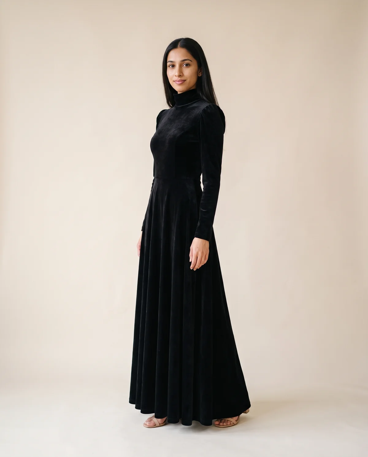 Velvet High-Neck Long-Sleeve Maxi Dress in Black, side view, worn by Priya