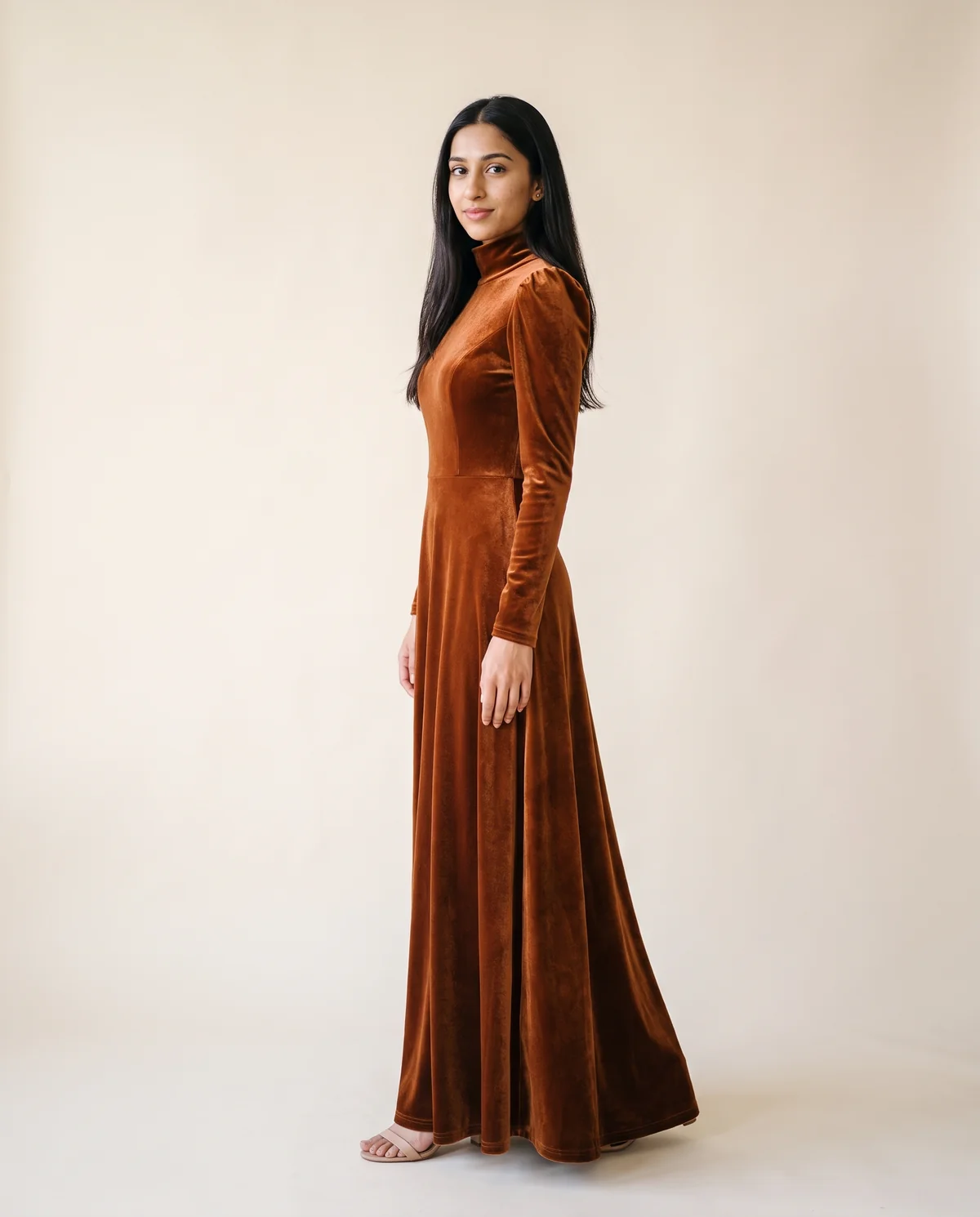 Velvet High-Neck Long-Sleeve Maxi Dress in Copper, side view, worn by Priya