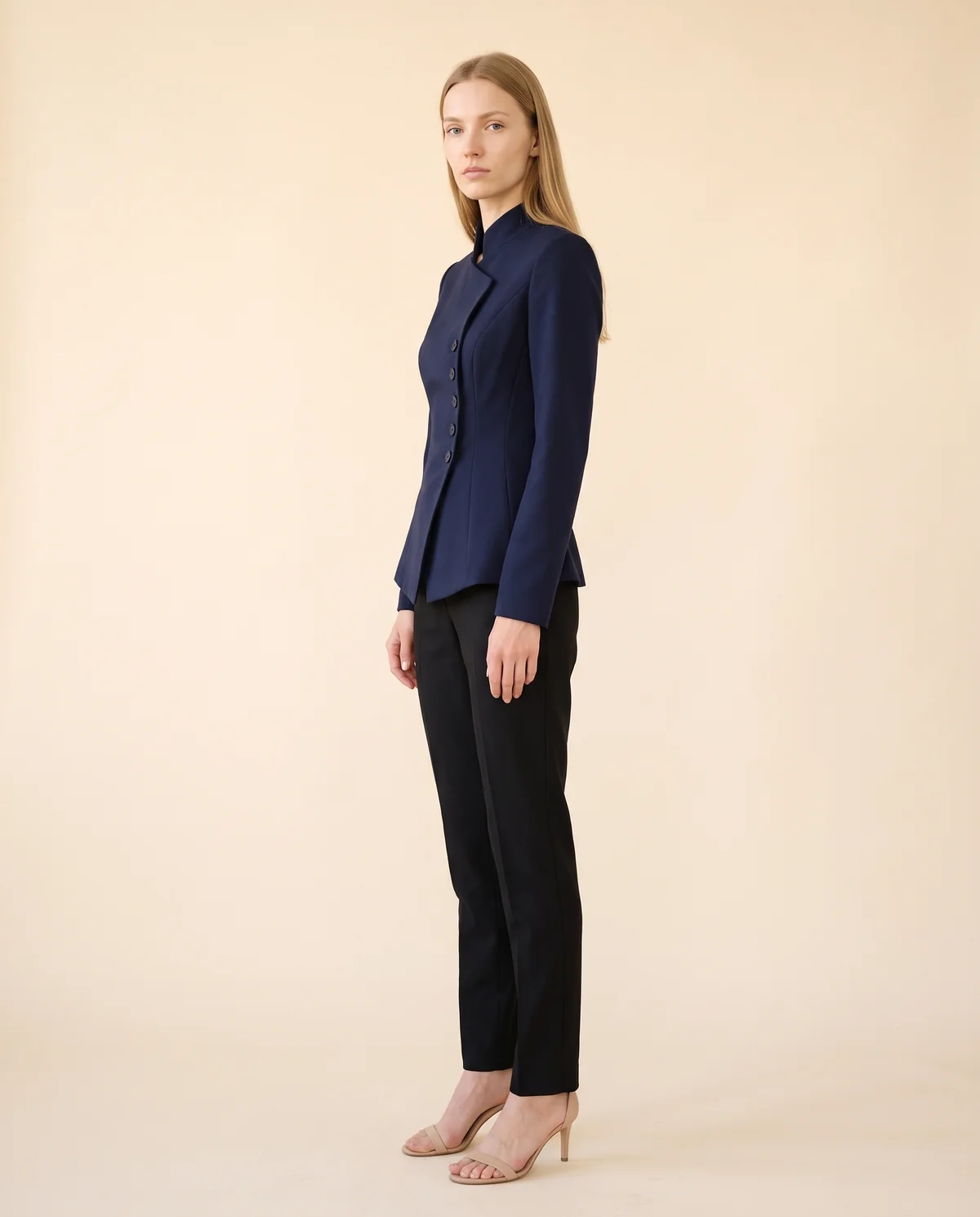 Asymmetric Stand-Collar Blazer in Navy, side view, worn by Maya