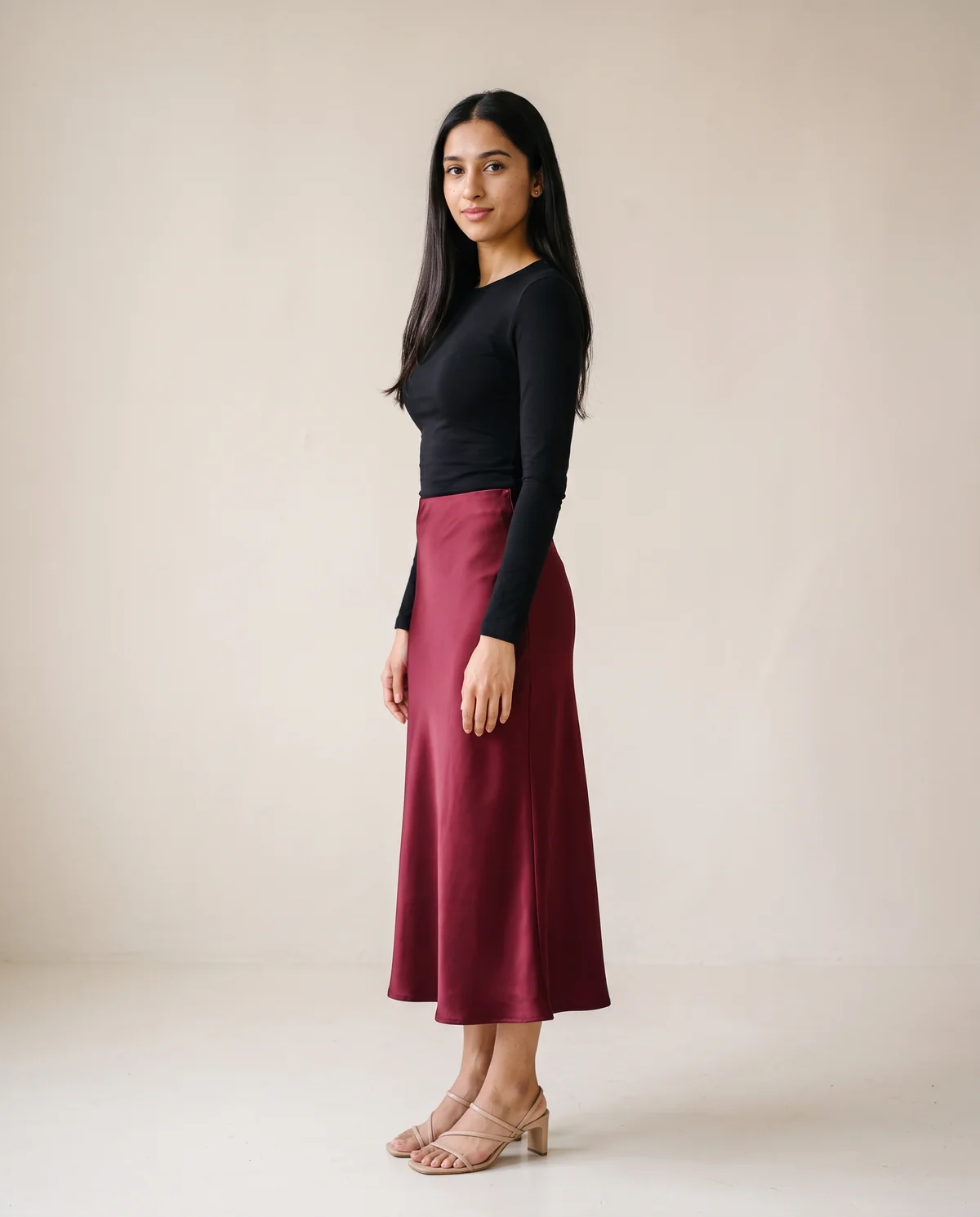Satin Bias-Cut Midi Skirt in Burgundy, side view, worn by Priya