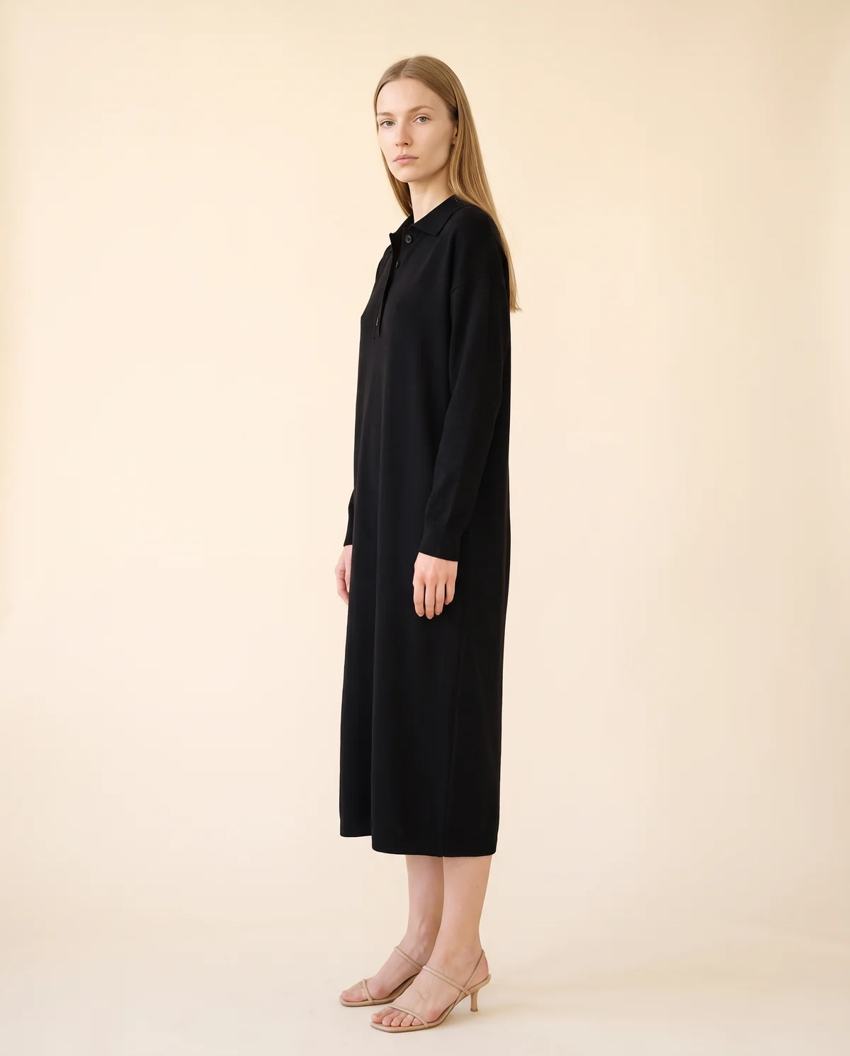 Button-Collar Knit Sweater Midi Dress in Black, side view, worn by Maya