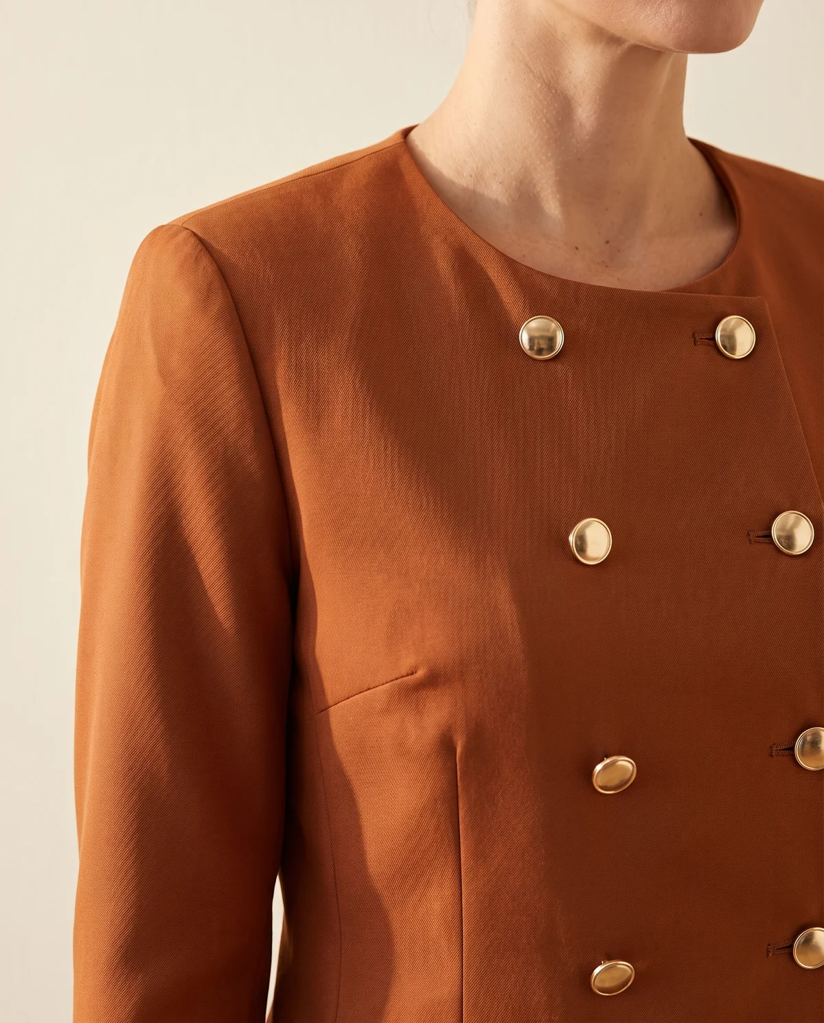 Round-Neck Double-Breasted Jacket in Rust, close-up of the detail