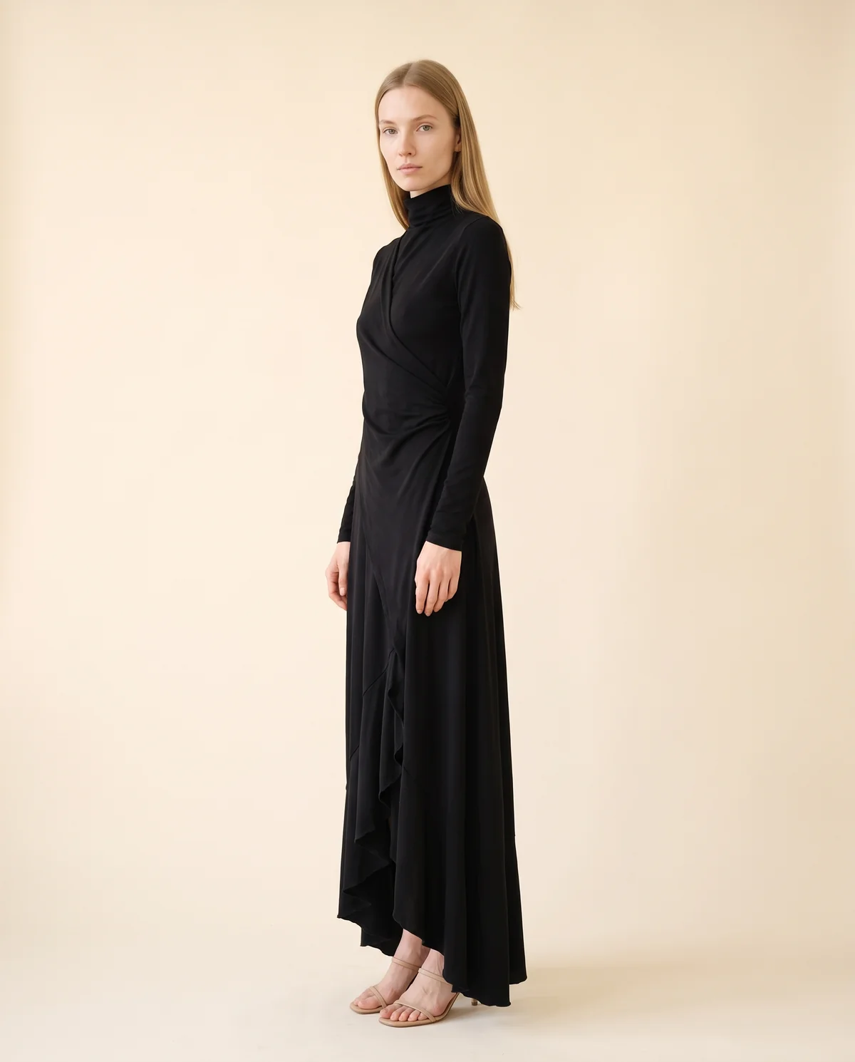 High-Neck Long-Sleeve Draped Maxi Dress in Black, side view, worn by Maya