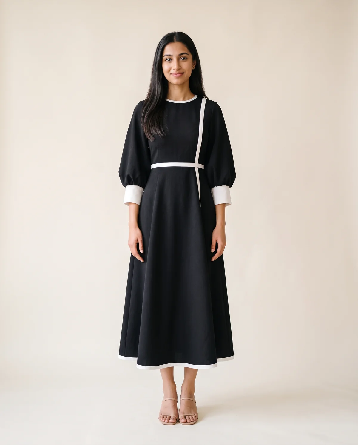 Contrast-Trim Fit-and-Flare Midi Dress in Black, front view, worn by Priya