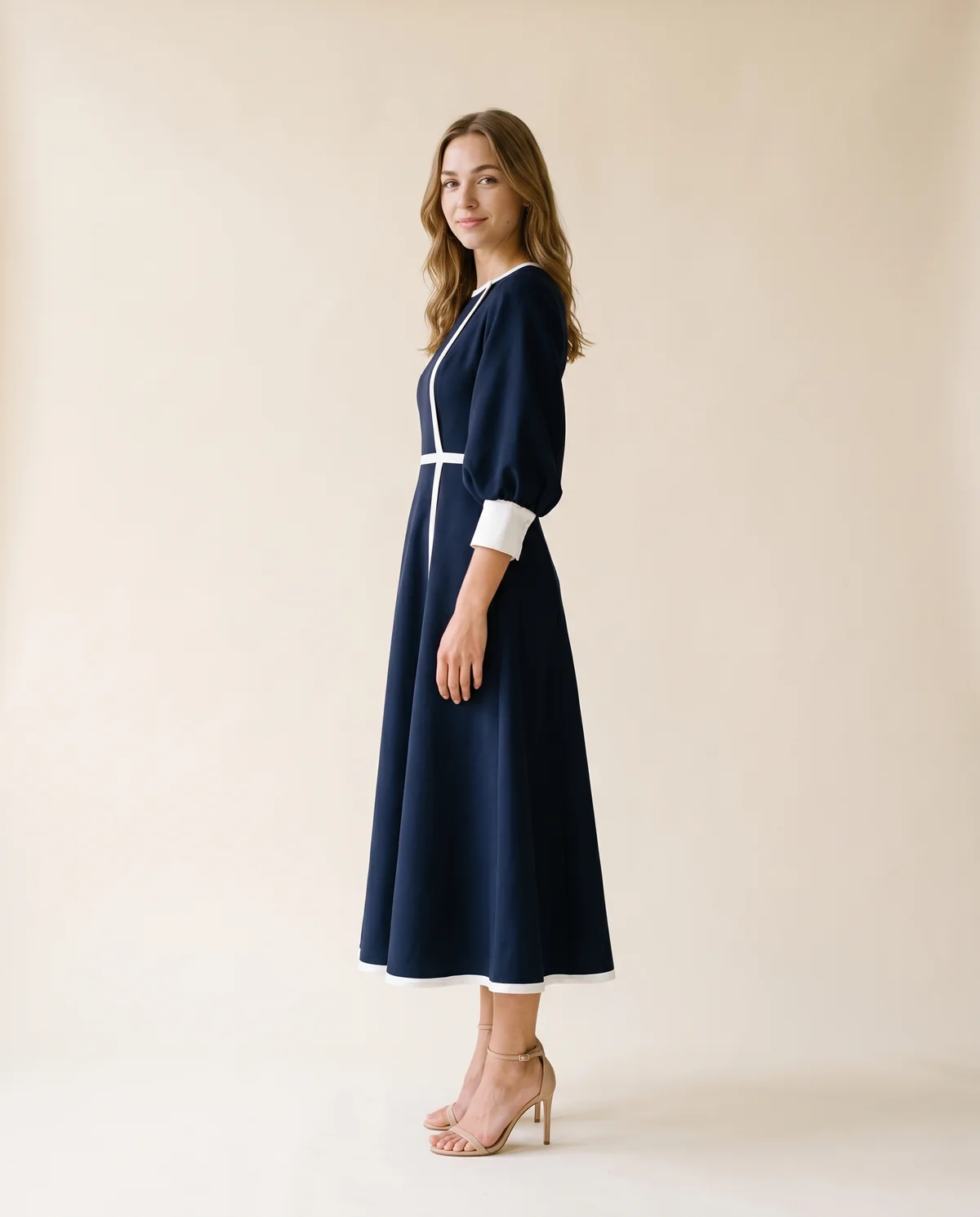 Contrast-Trim Fit-and-Flare Midi Dress in Navy, side view, worn by Ava