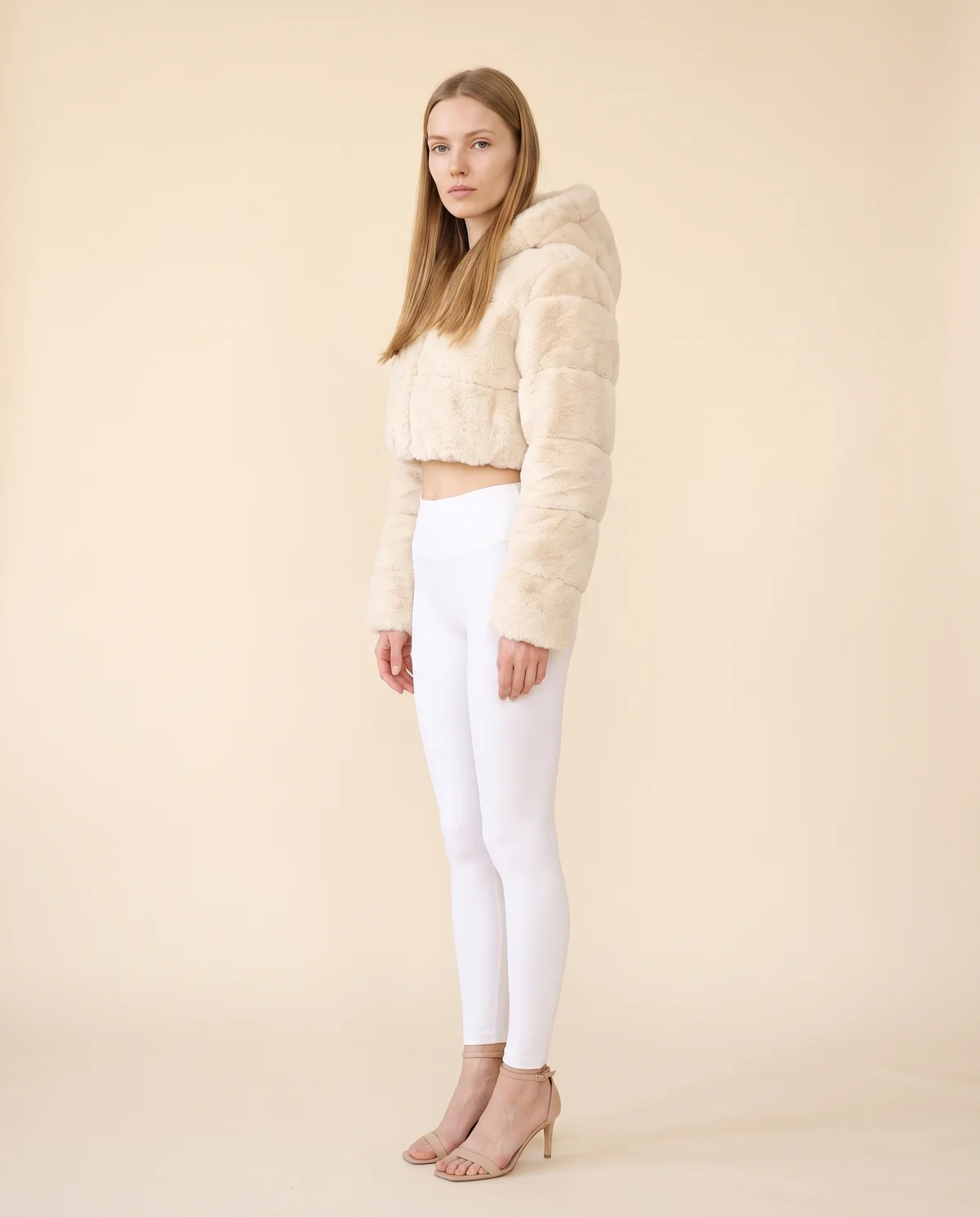 Hooded Cropped Faux Fur Jacket in Cream, side view, worn by Maya