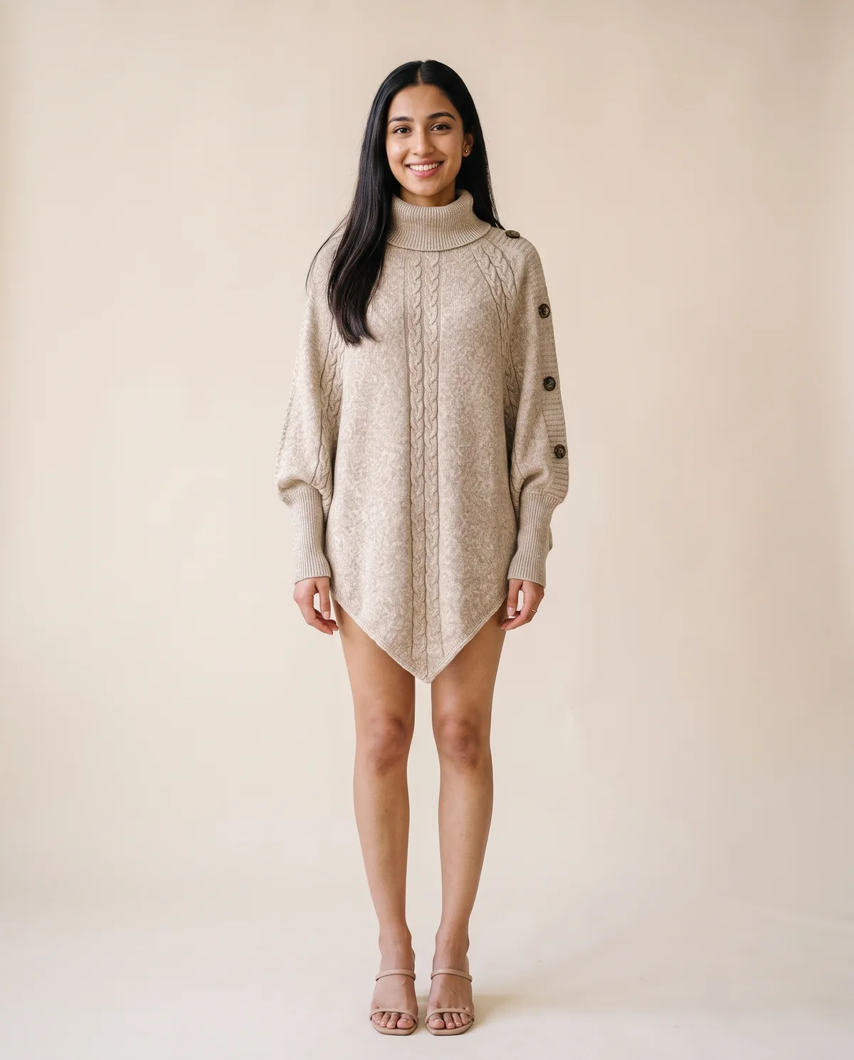 Cable Knit Roll Neck Button Cape Jumper in Oatmeal, front view, worn by Priya