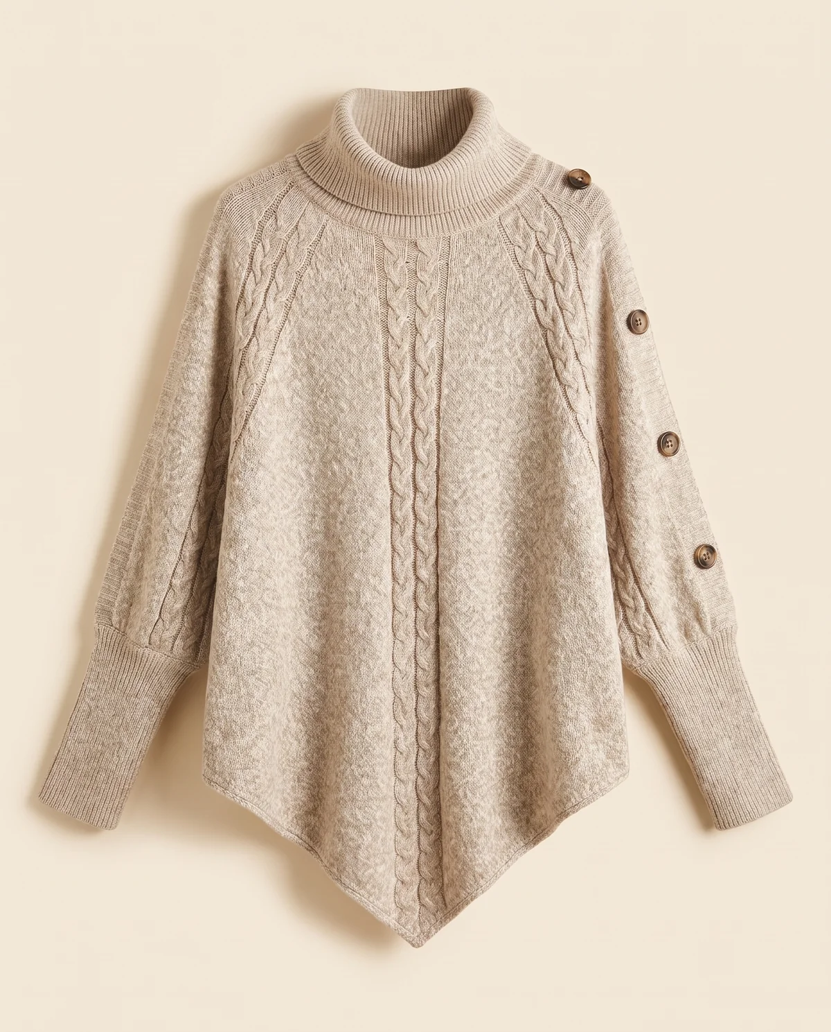 Cable Knit Roll Neck Button Cape Jumper in Oatmeal, product shot on a plain background