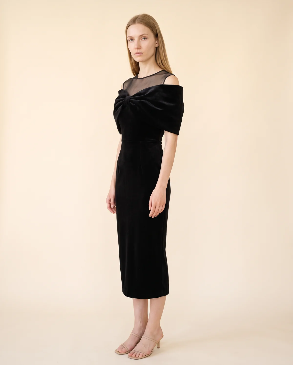 Velvet Bow-Shoulder Sheath Midi Dress in Black, side view, worn by Maya