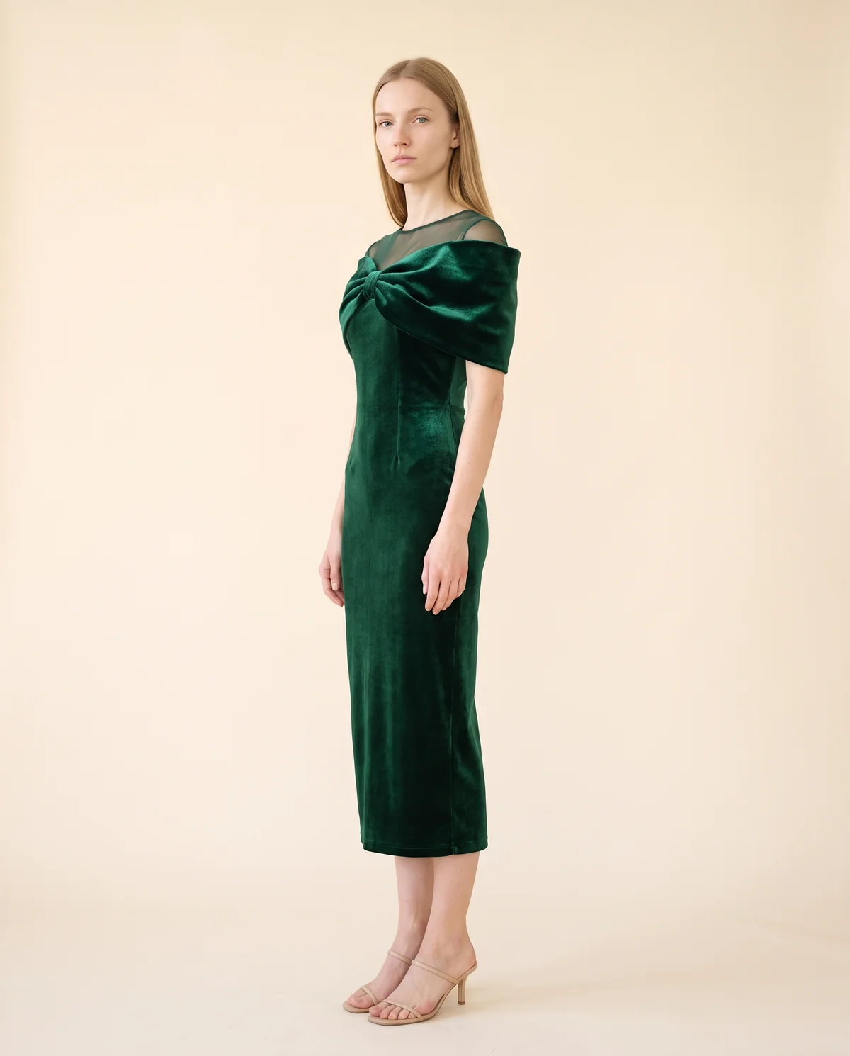 Velvet Bow-Shoulder Sheath Midi Dress in Emerald, side view, worn by Maya