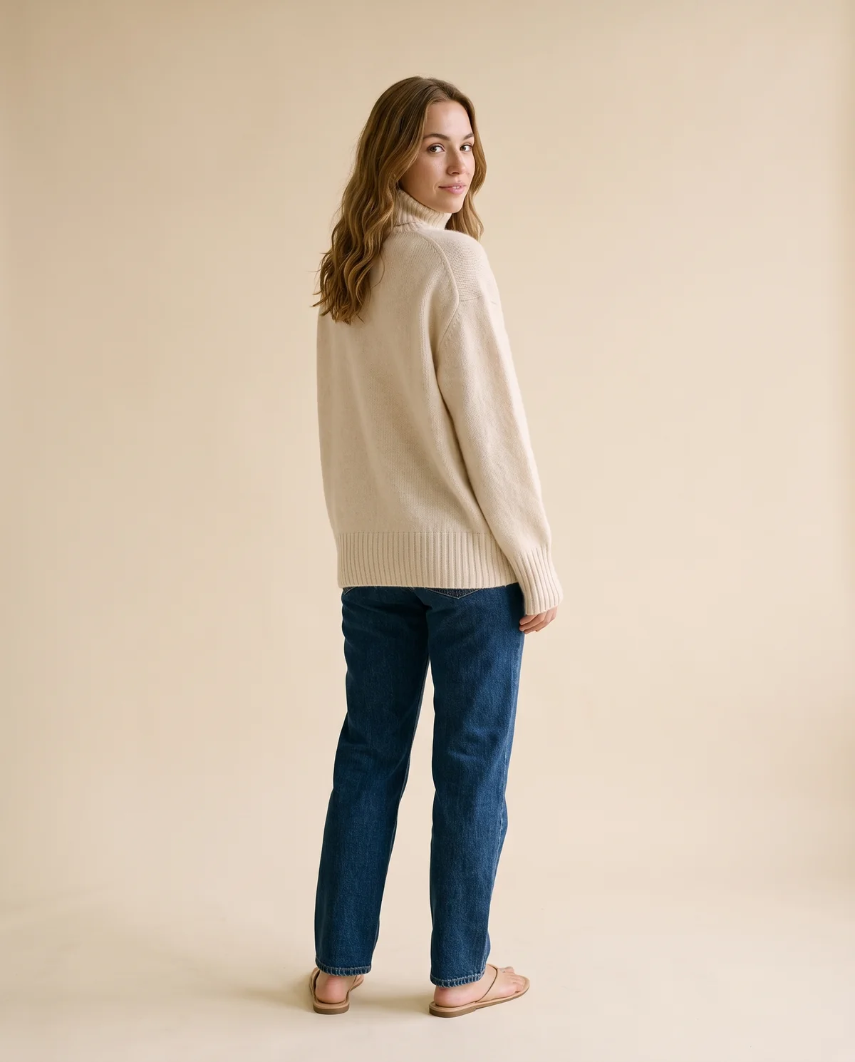 Soft Knit Roll Neck Jumper in Cream, back view, worn by Ava