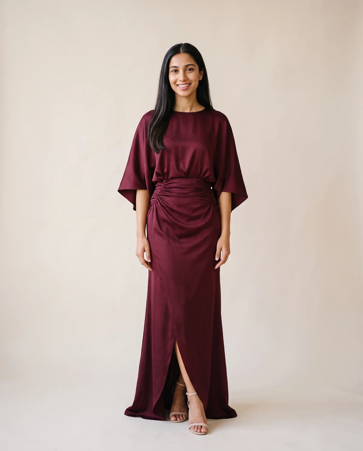 Satin Batwing-Sleeve Maxi Dress with Slit in Wine, front view, worn by Priya
