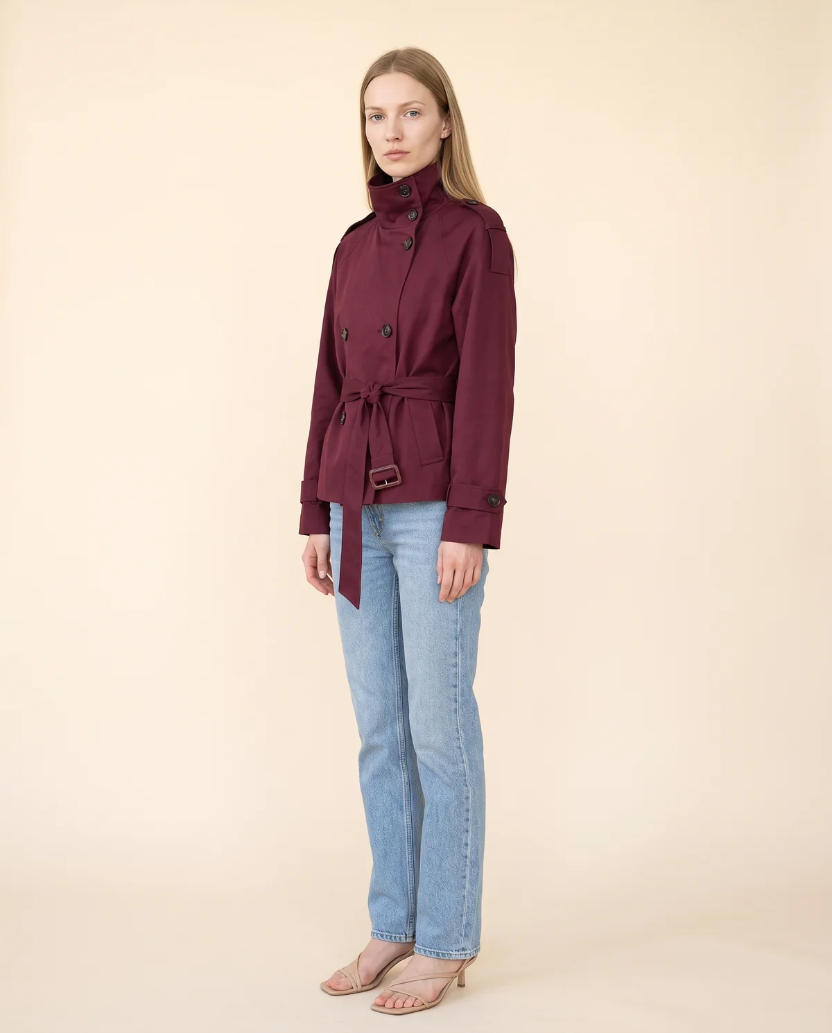 Short Belted Trench Jacket in Burgundy, side view, worn by Maya