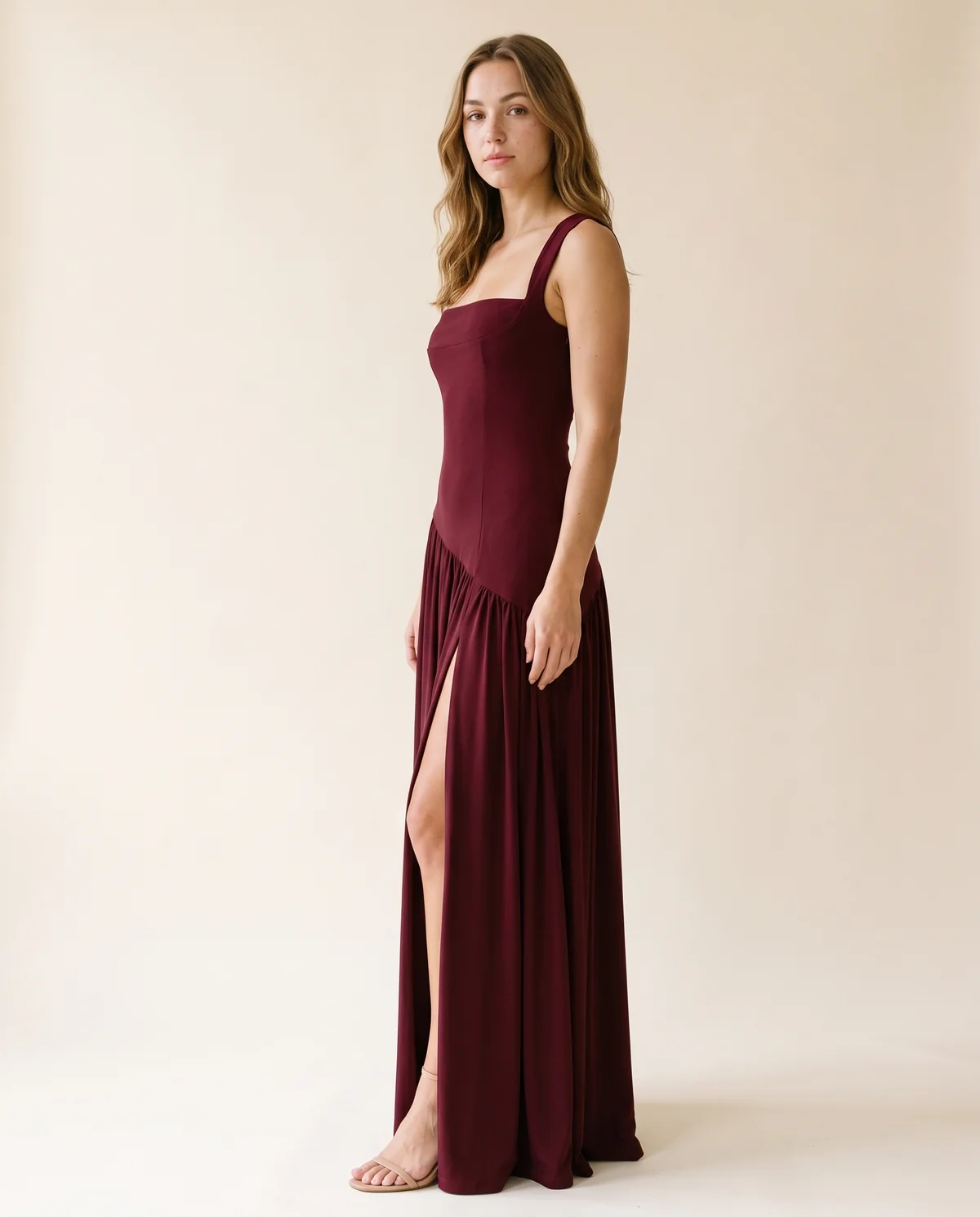 Square-Neck Pleated Slit Maxi Dress in Wine, side view, worn by Ava