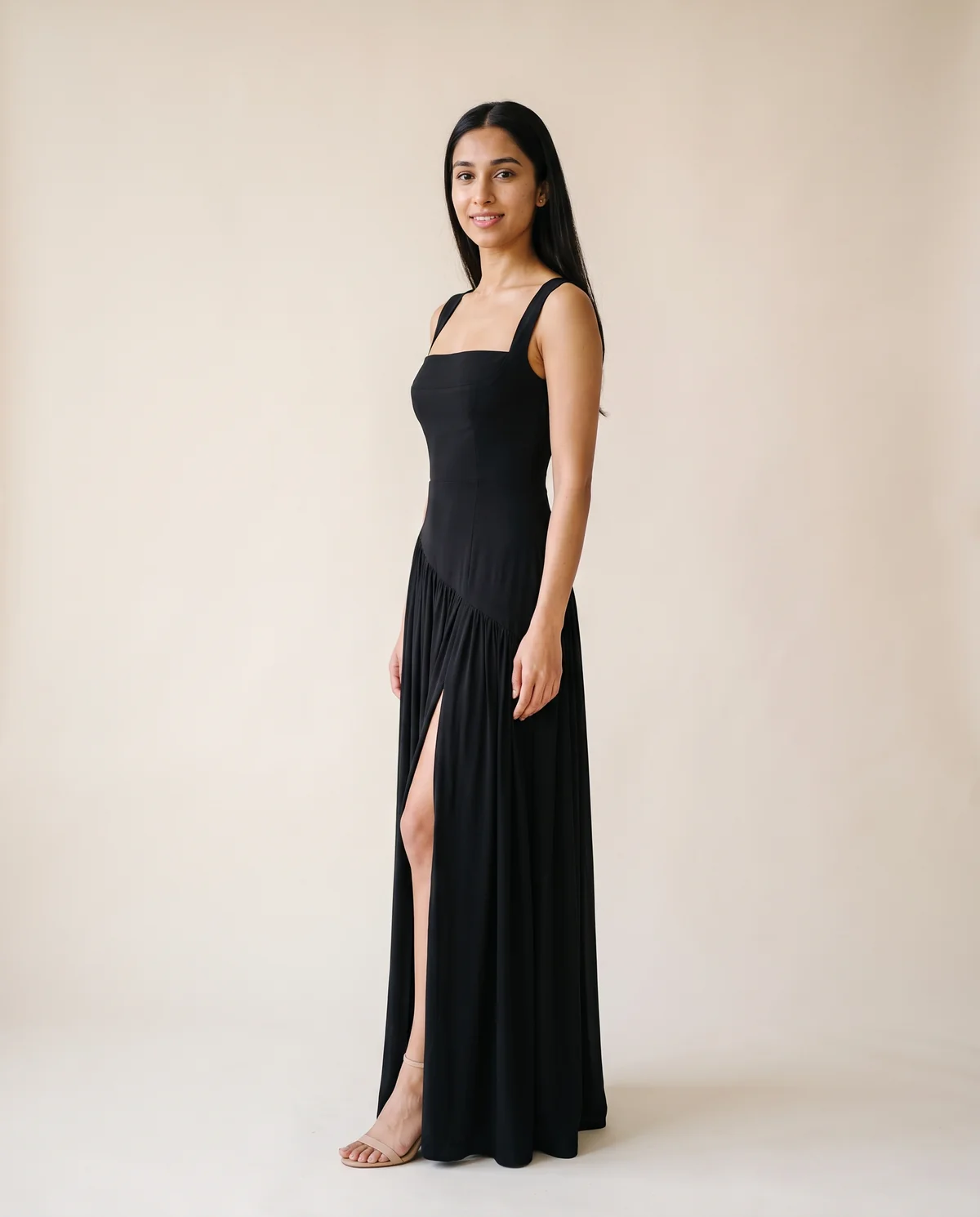 Square-Neck Pleated Slit Maxi Dress in Black, side view, worn by Priya