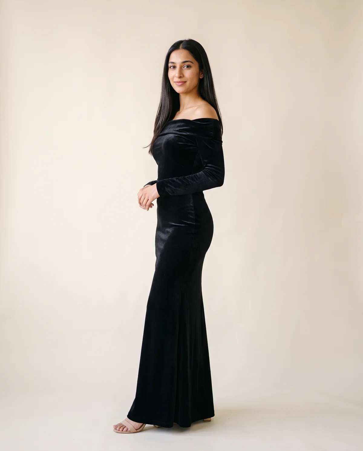 Velvet Off-Shoulder Long-Sleeve Mermaid Maxi in Black, side view, worn by Priya