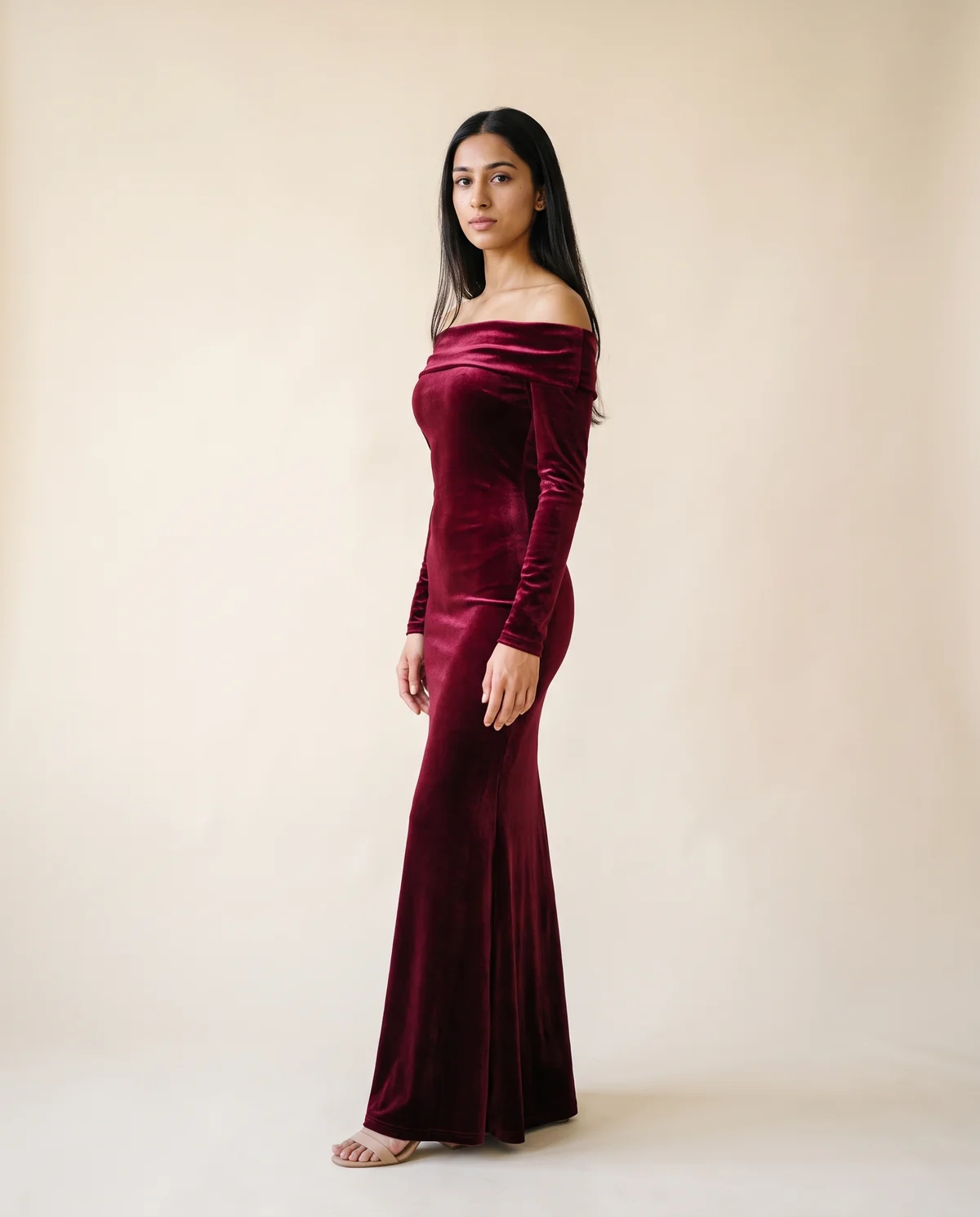 Velvet Off-Shoulder Long-Sleeve Mermaid Maxi in Wine, side view, worn by Priya