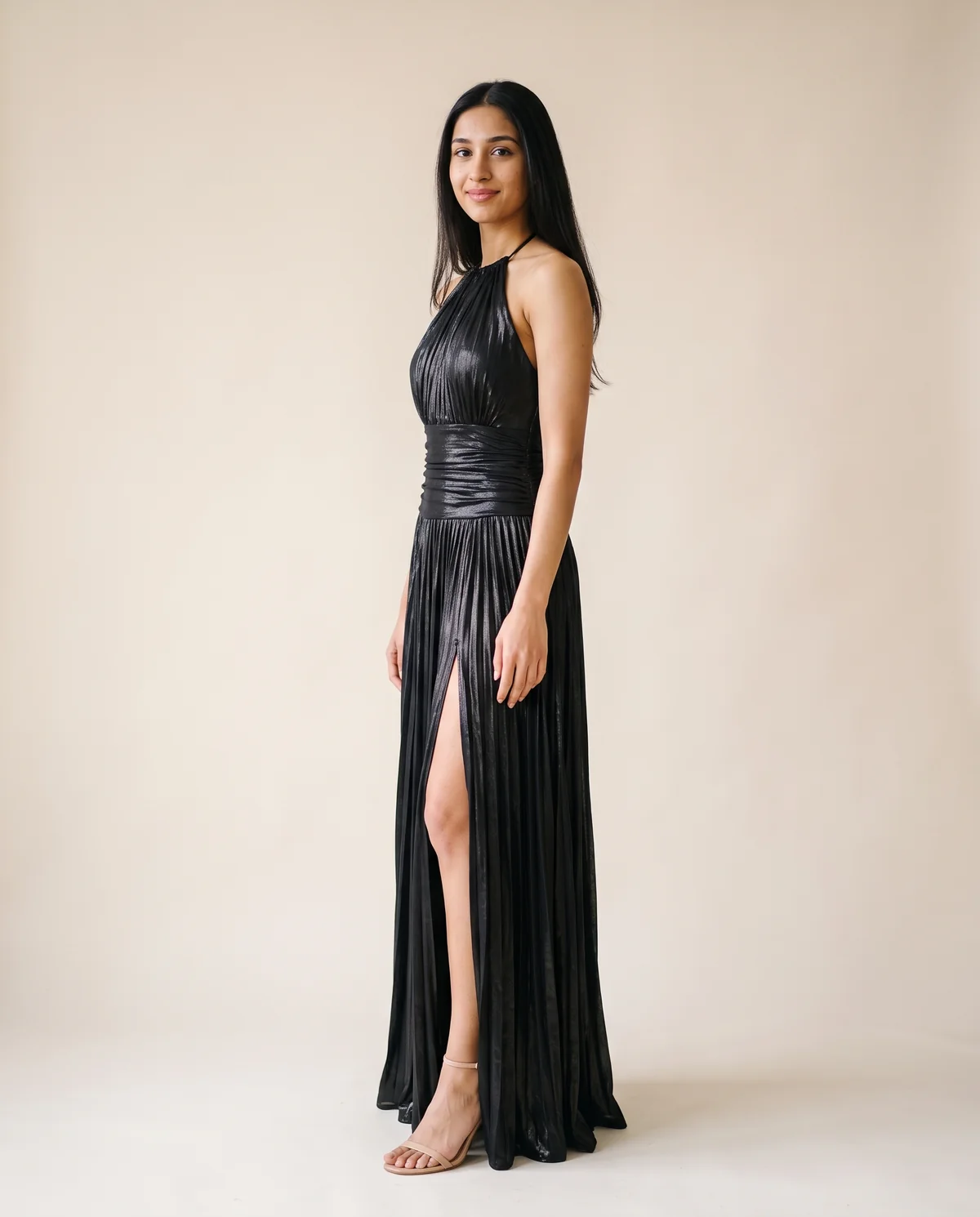 Metallic Pleated Halter Maxi Dress in Black, side view, worn by Priya