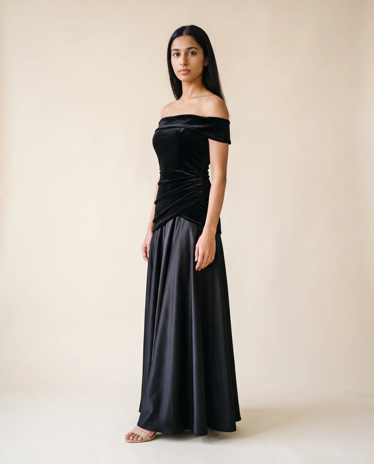 Off-Shoulder Velvet-Look Bodice Maxi Dress in Black, side view, worn by Priya