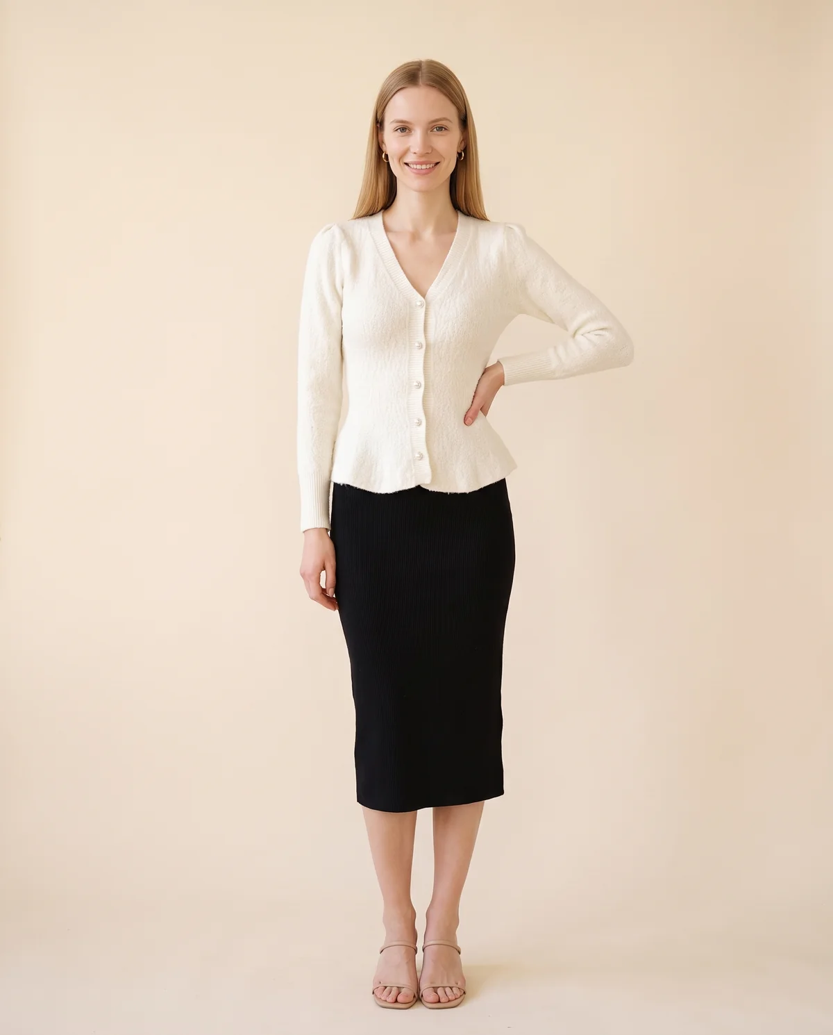 Pearl Button Peplum Cardigan in Ivory, front view, worn by Maya