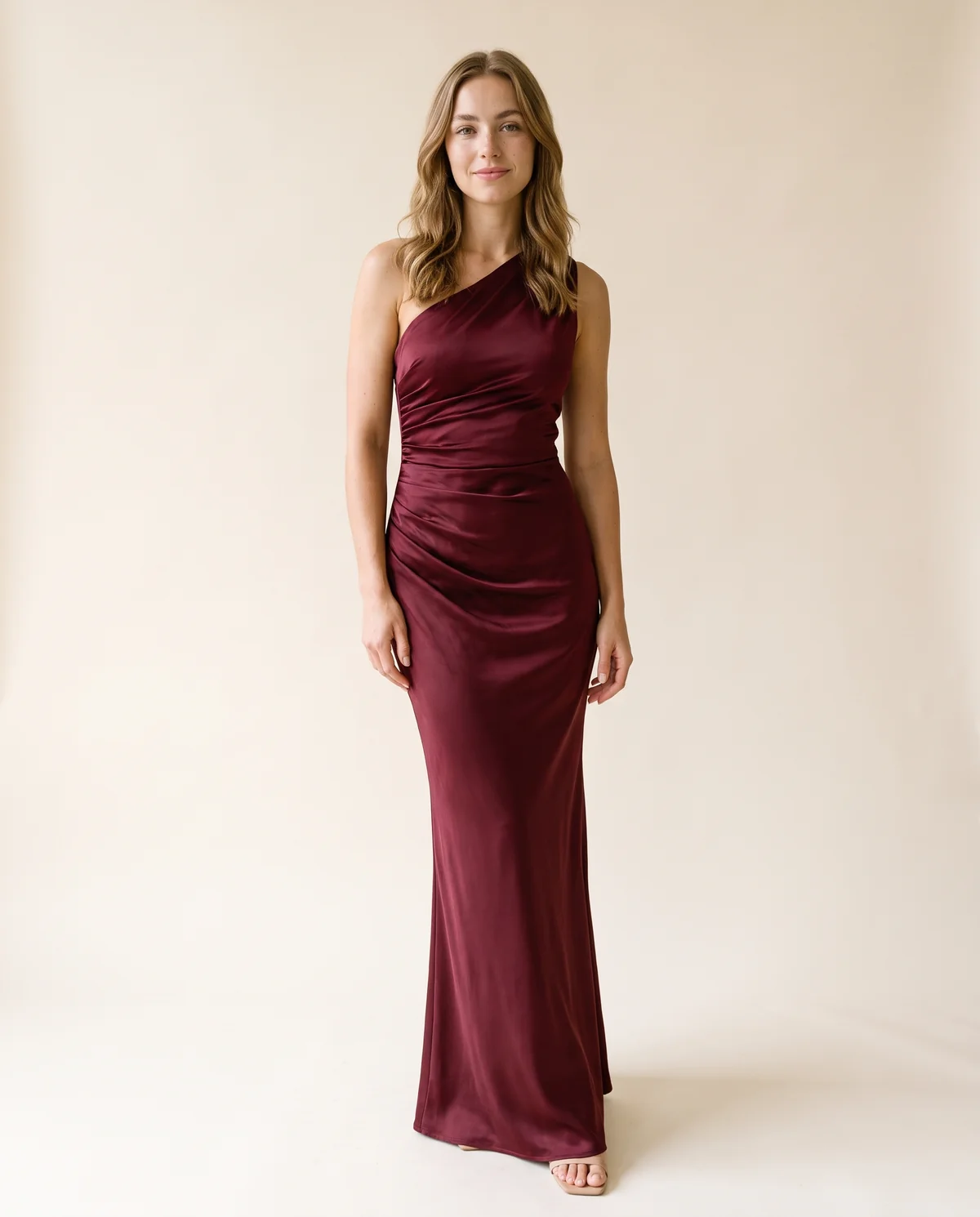 One-Shoulder Draped Satin Maxi Dress in Wine, front view, worn by Ava
