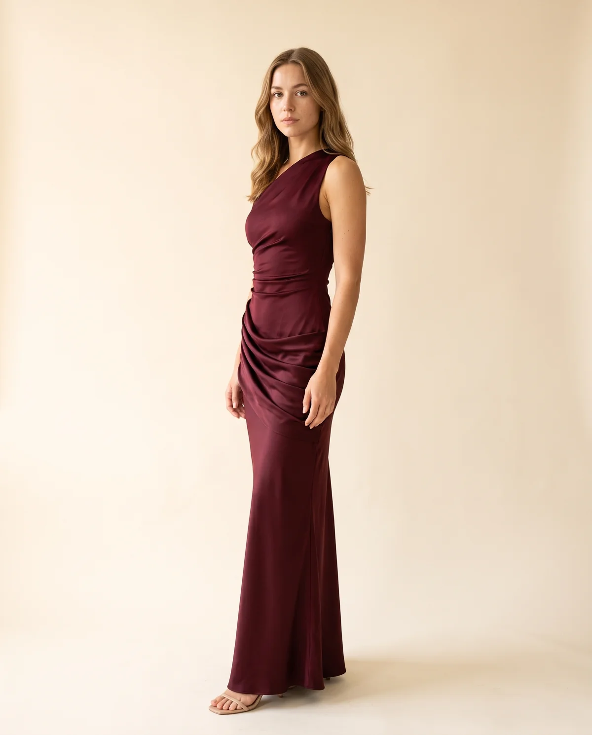 One-Shoulder Draped Satin Maxi Dress in Wine, side view, worn by Ava