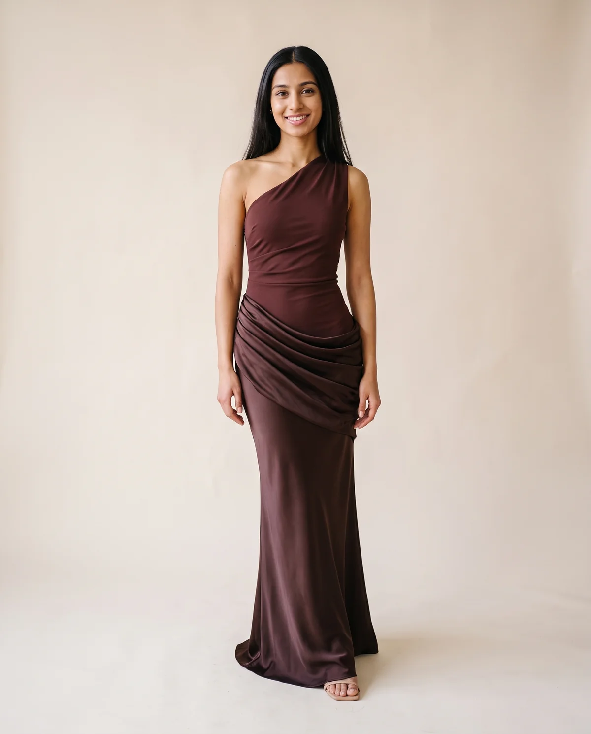One-Shoulder Draped Satin Maxi Dress in Chocolate, front view, worn by Priya
