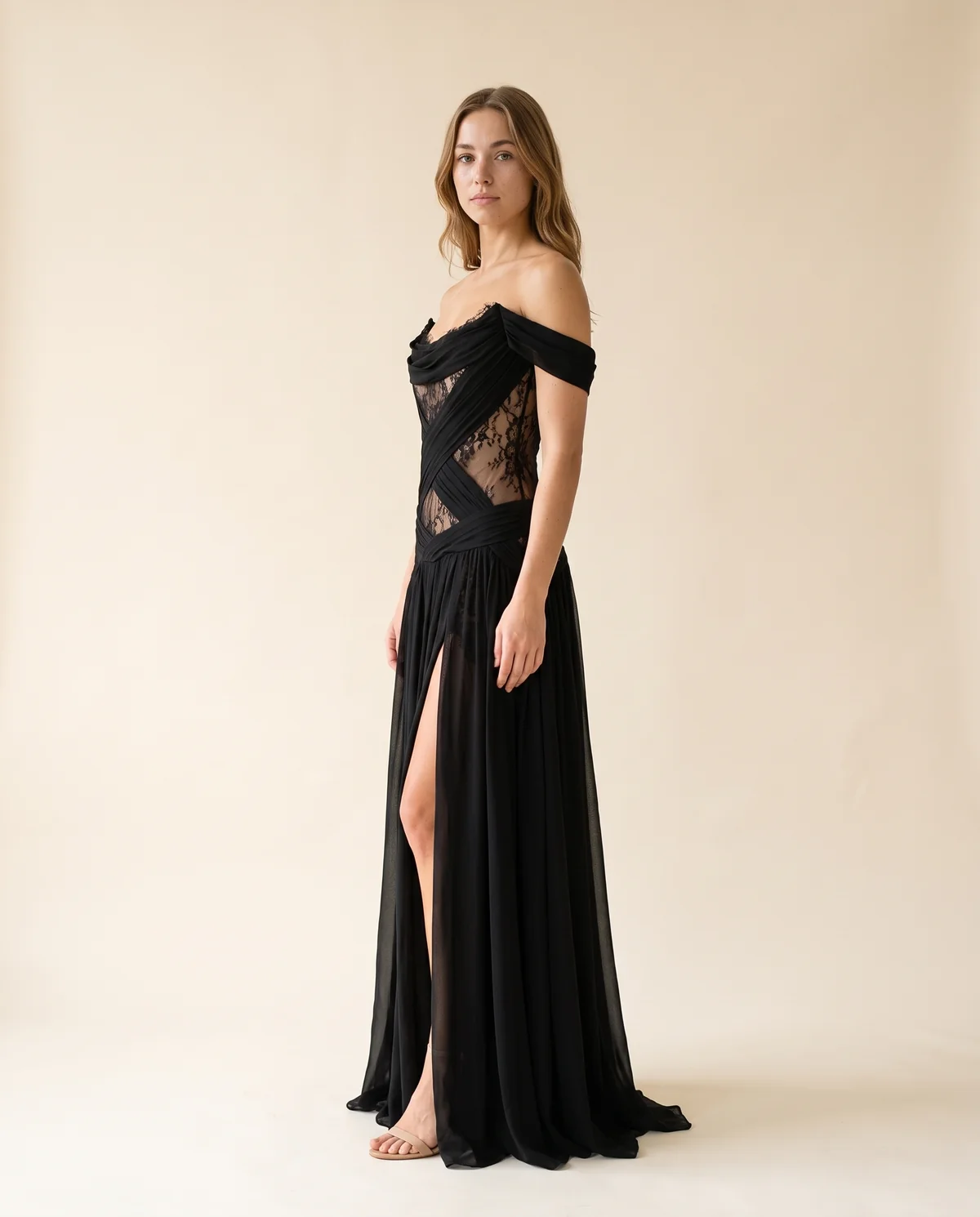 Off-Shoulder Lace Cut-Out Chiffon Maxi Dress in Black, side view, worn by Ava