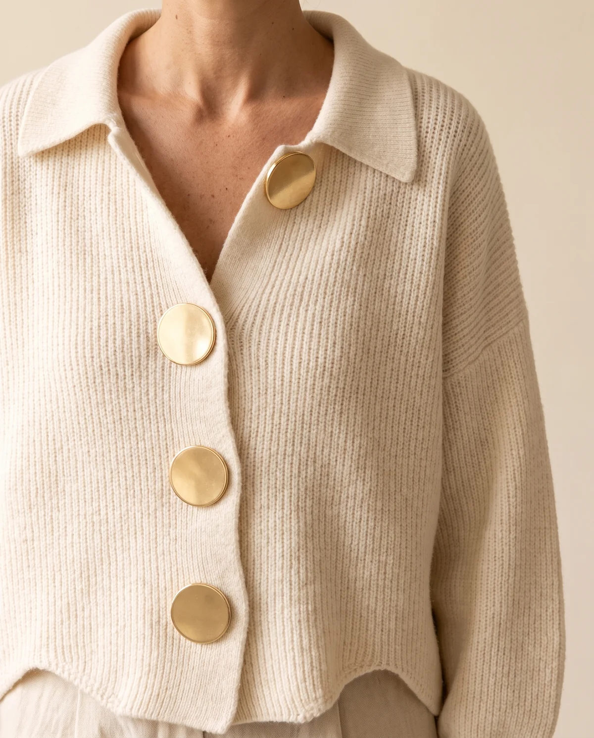 Collared Cardigan with Gold Buttons in Cream, close-up of the detail