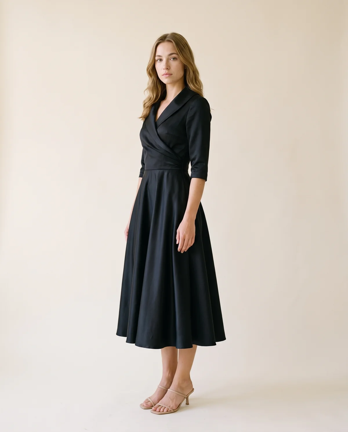 Wrap-Front Full-Skirt Midi Dress in Black, side view, worn by Ava