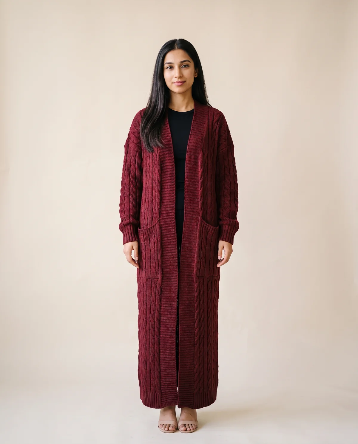 Chunky Cable Maxi Cardigan with Pockets in Burgundy, front view, worn by Priya