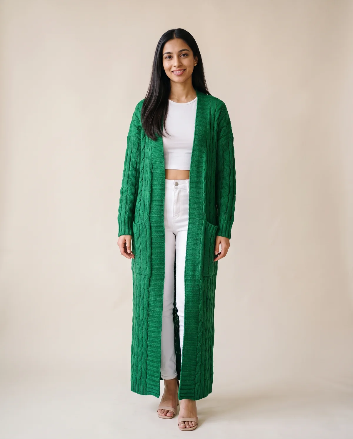 Chunky Cable Maxi Cardigan with Pockets in Emerald, front view, worn by Priya