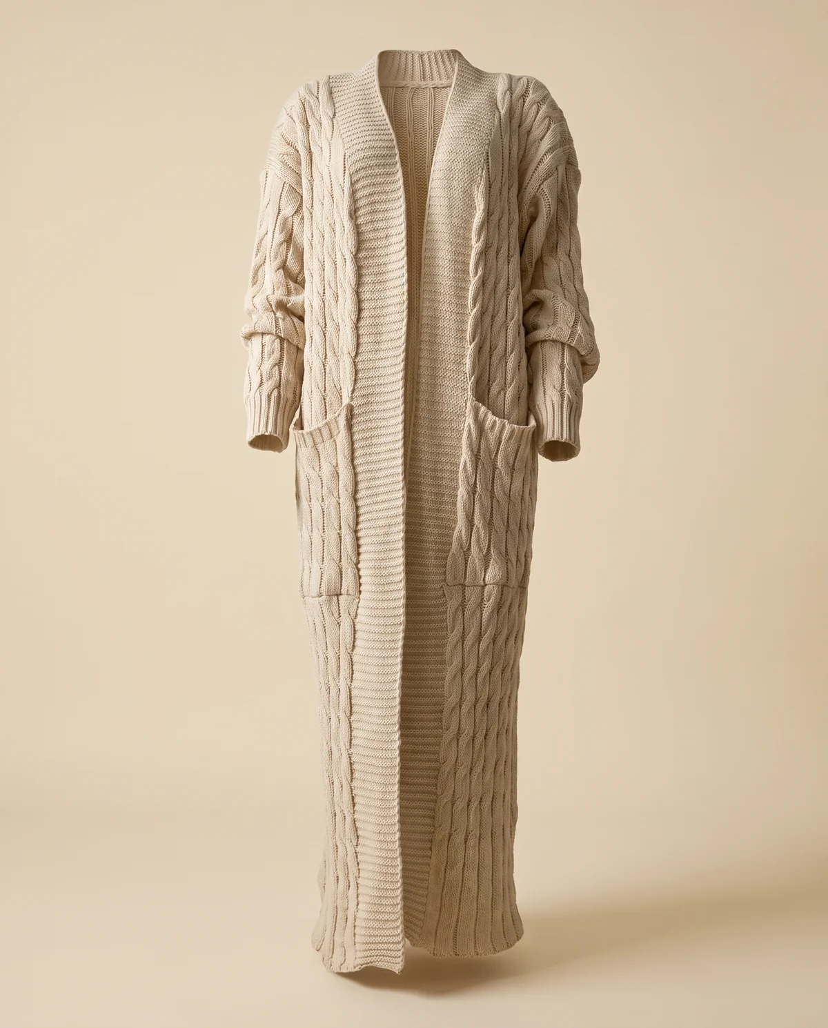 Chunky Cable Maxi Cardigan with Pockets in Beige, product shot on a plain background