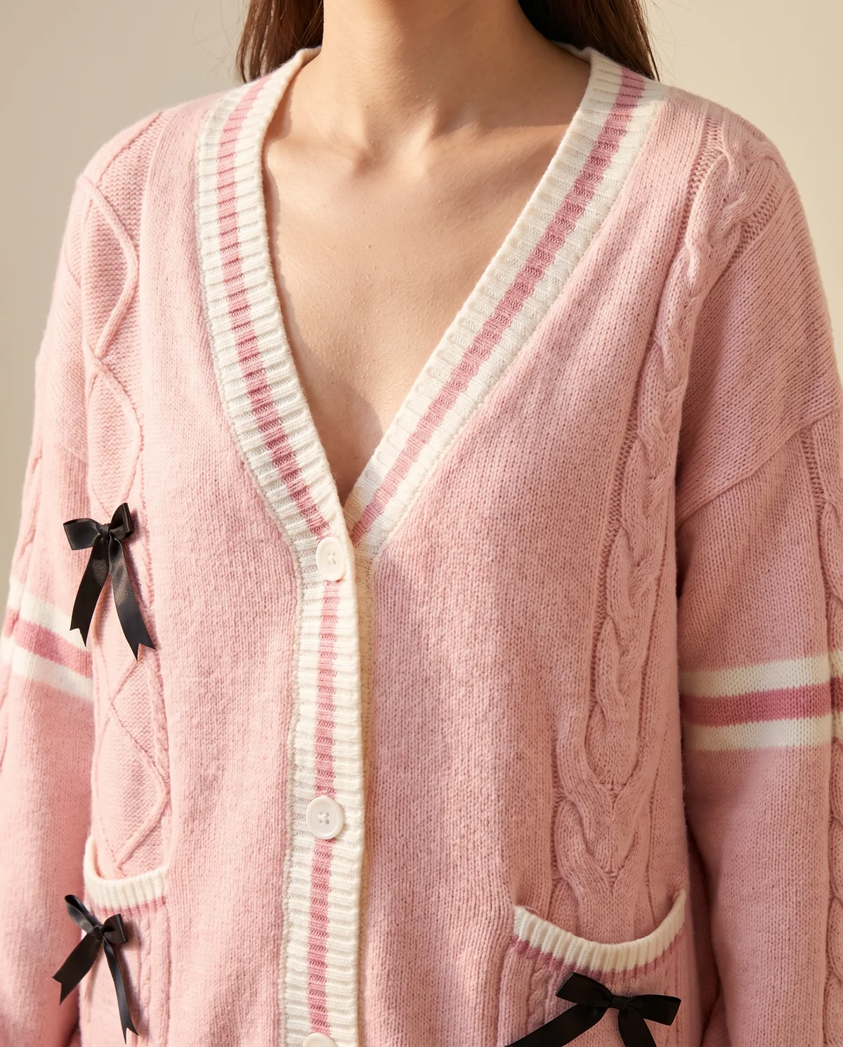 Bow Detail Cable Knit Cardigan in Pink, close-up of the detail