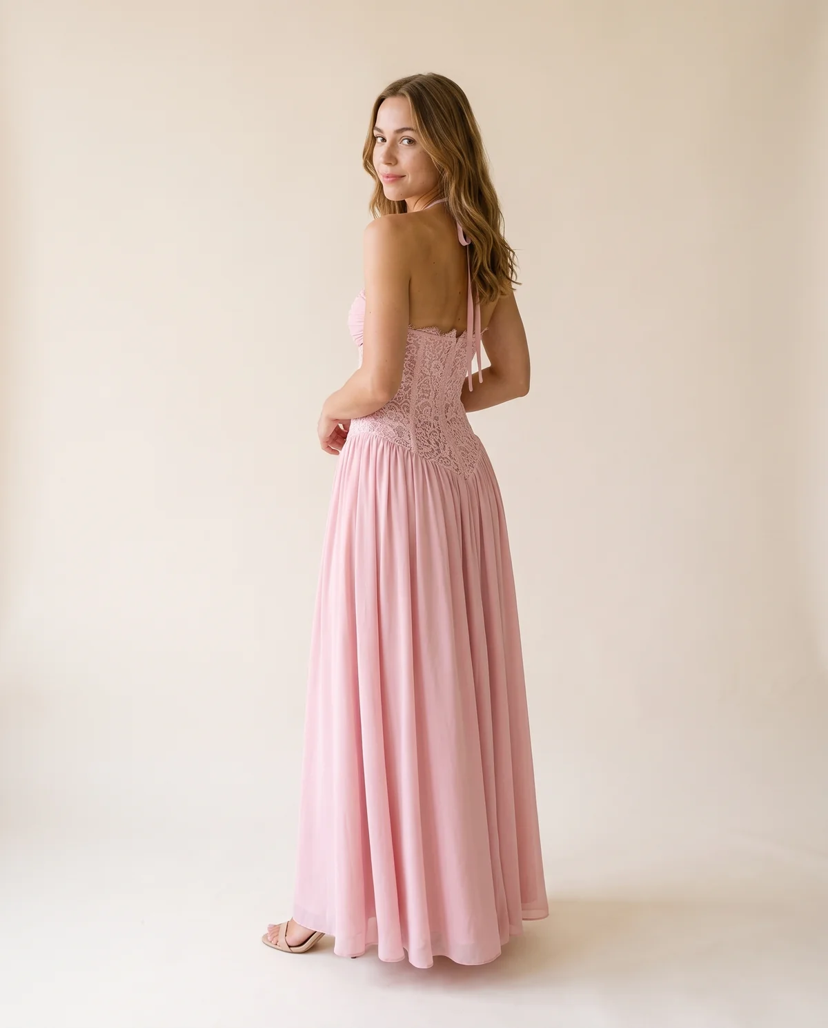 Lace Halter Corset Maxi Dress with Chiffon Skirt in Blush Pink, back view, worn by Ava