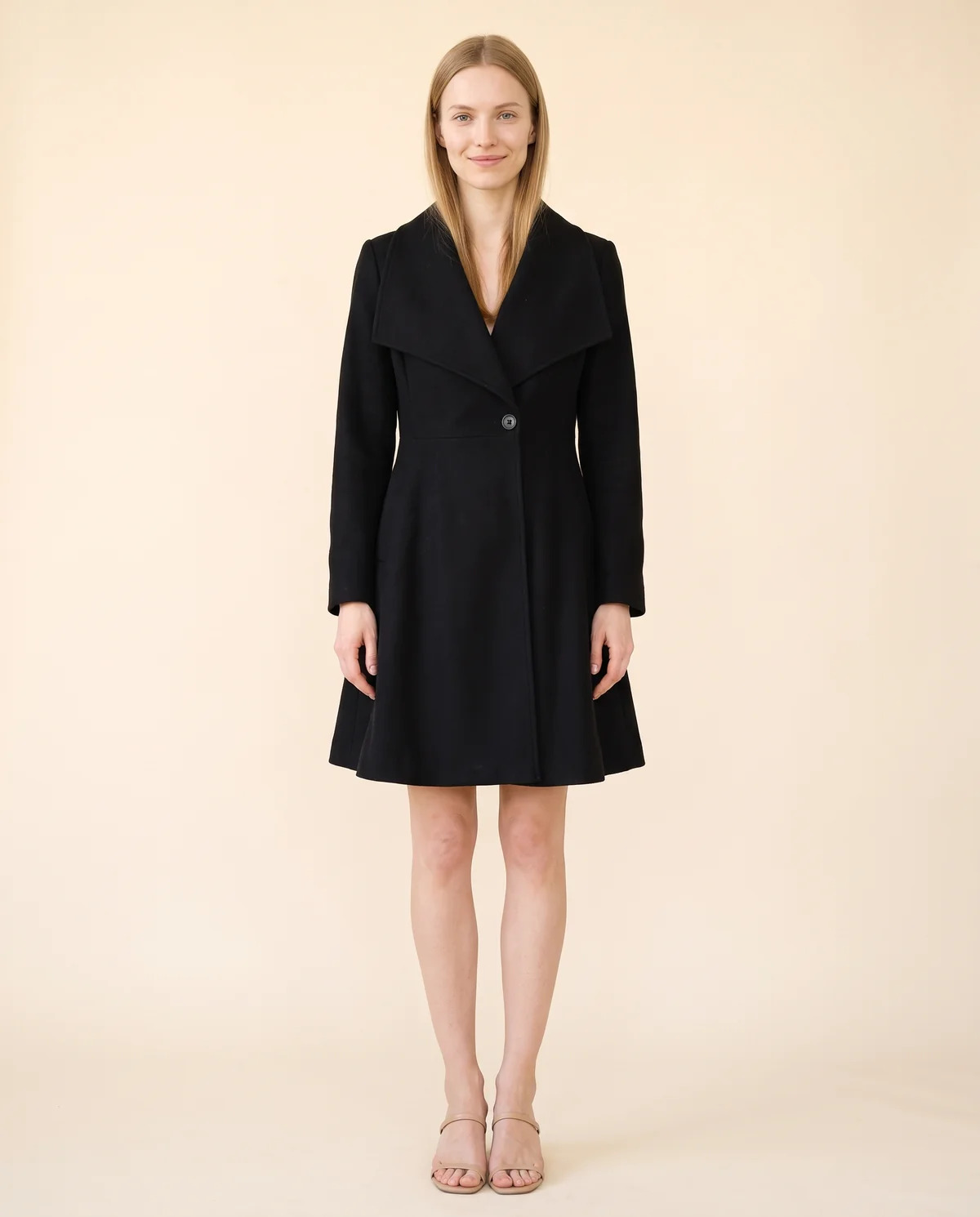 Wide-Lapel Flared Wool-Look Coat in Black, front view, worn by Maya