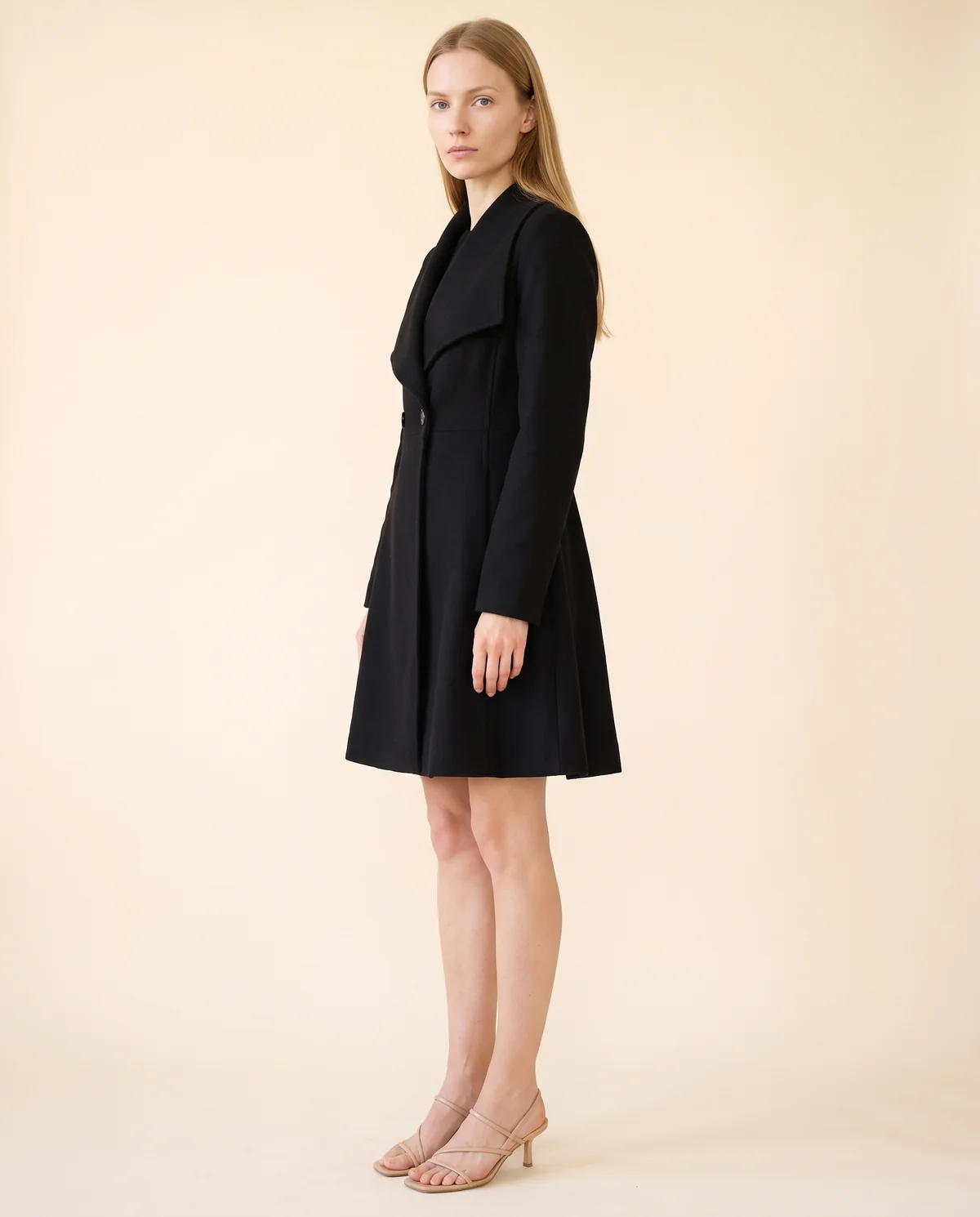 Wide-Lapel Flared Wool-Look Coat in Black, side view, worn by Maya