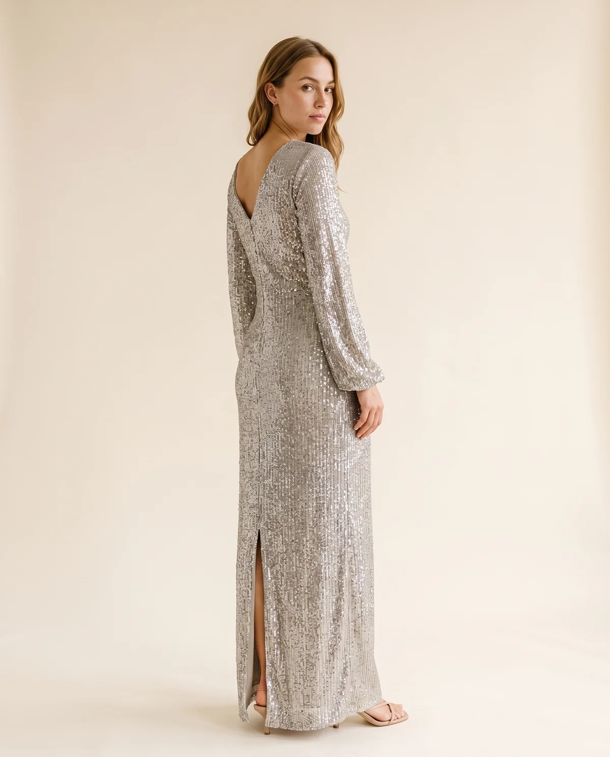 Long-Sleeve Sequin Slit Maxi Dress in Silver, back view, worn by Ava