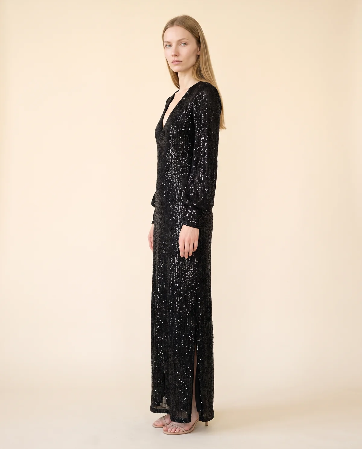 Long-Sleeve Sequin Slit Maxi Dress in Black, side view, worn by Maya