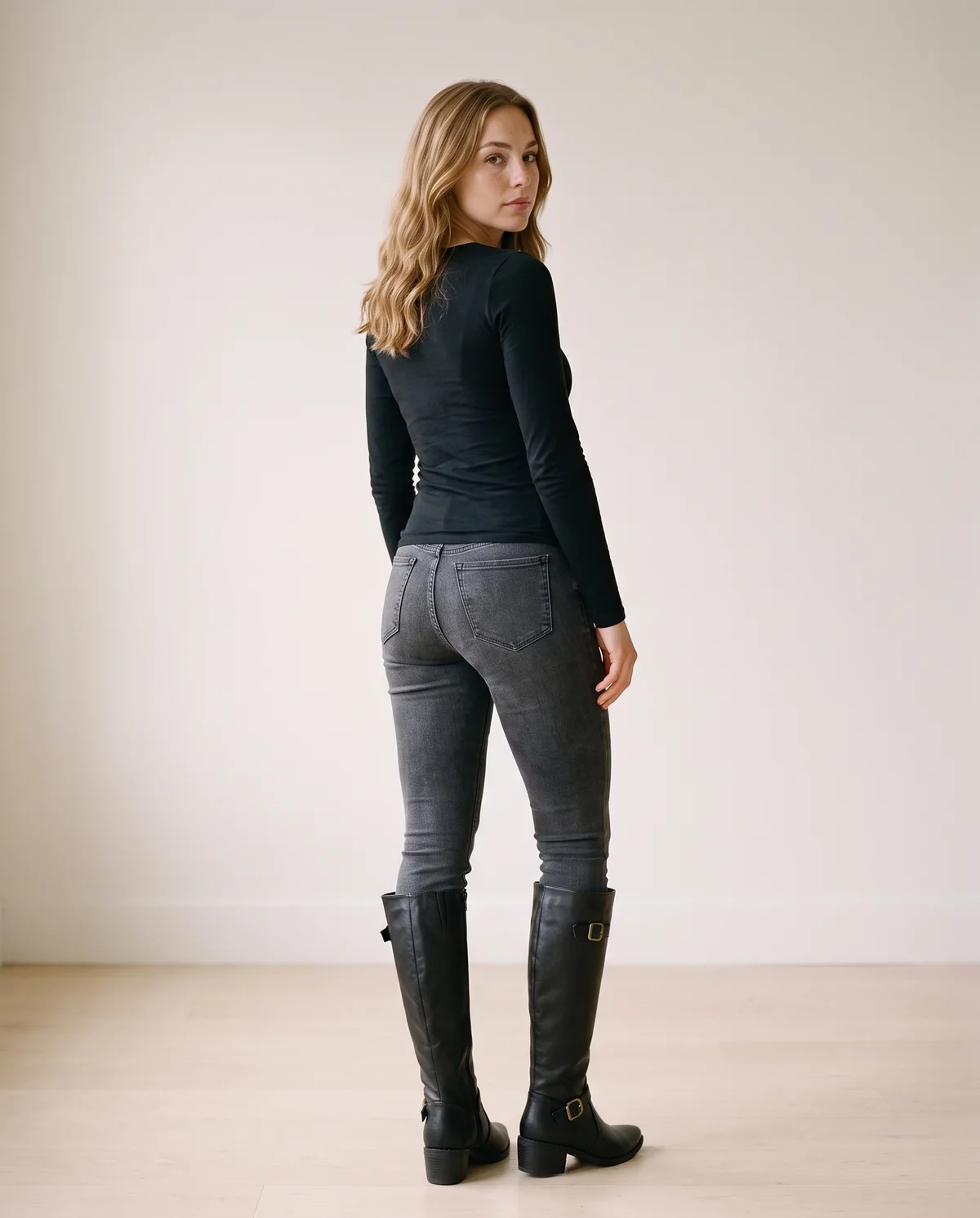 Buckle Block-Heel Knee-High Boot in Black, back view, worn by Ava