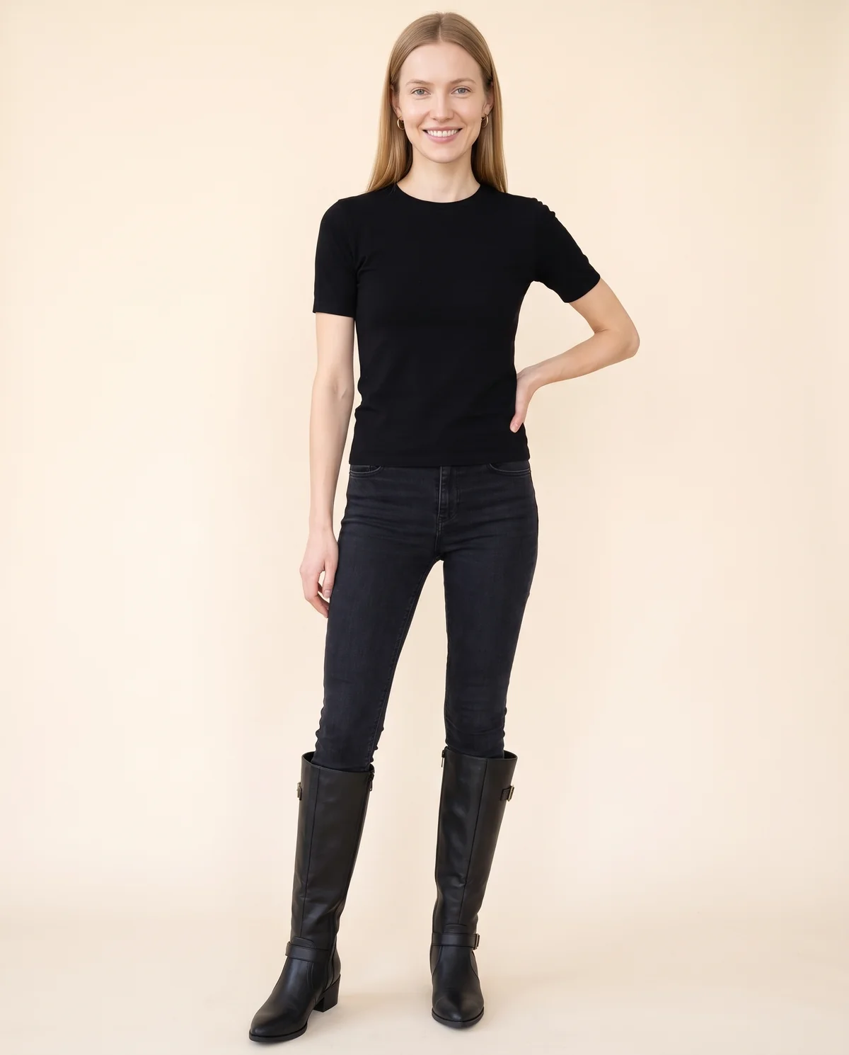 Buckle Block-Heel Knee-High Boot in Black, front view, worn by Maya