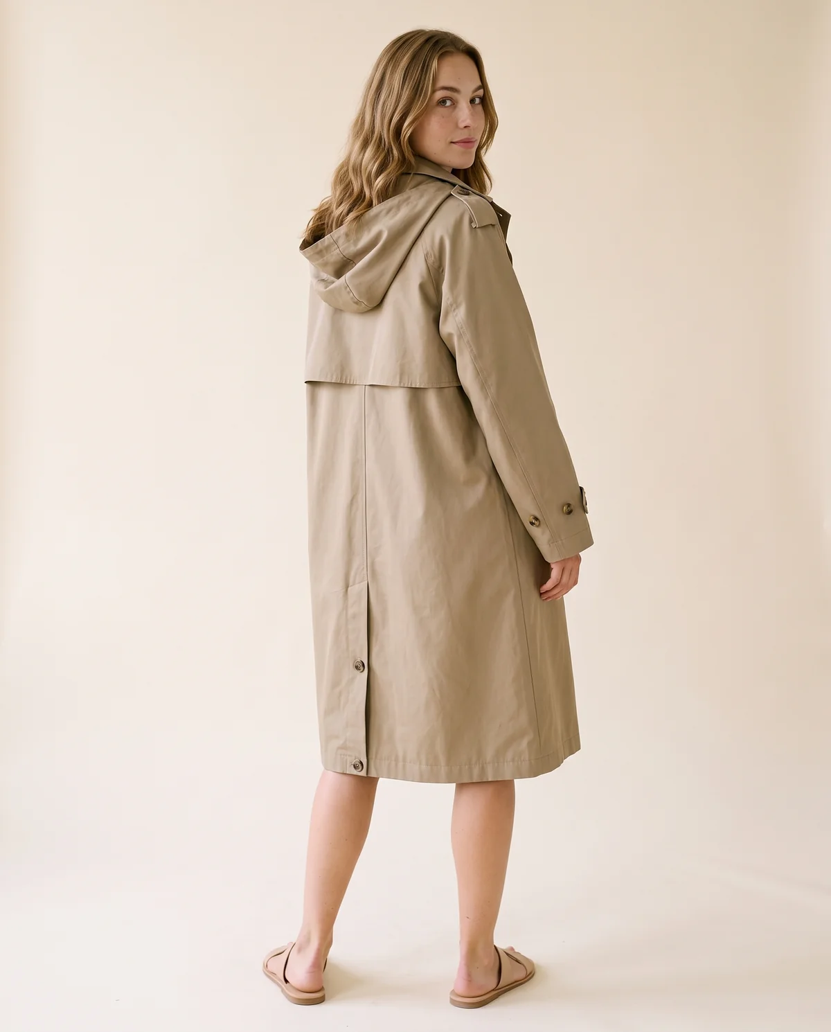 Hooded Trench Coat in Khaki, back view, worn by Ava