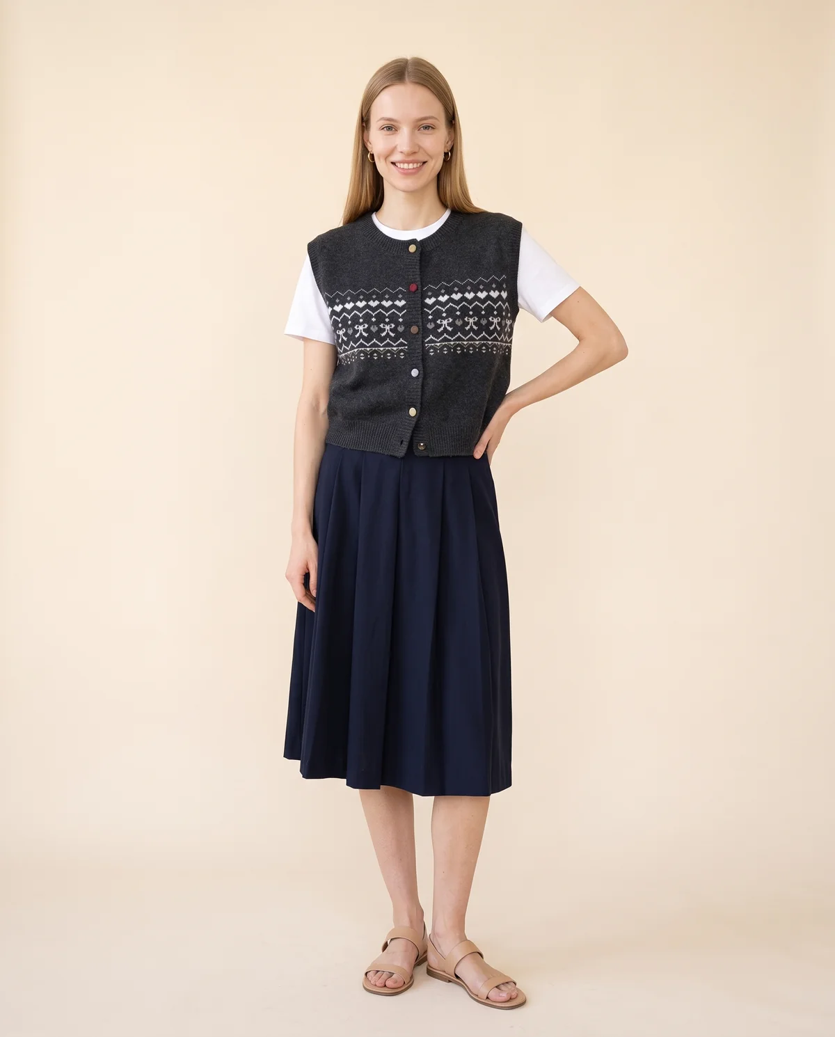 Fair Isle Bow Button Knit Vest in Charcoal, front view, worn by Maya