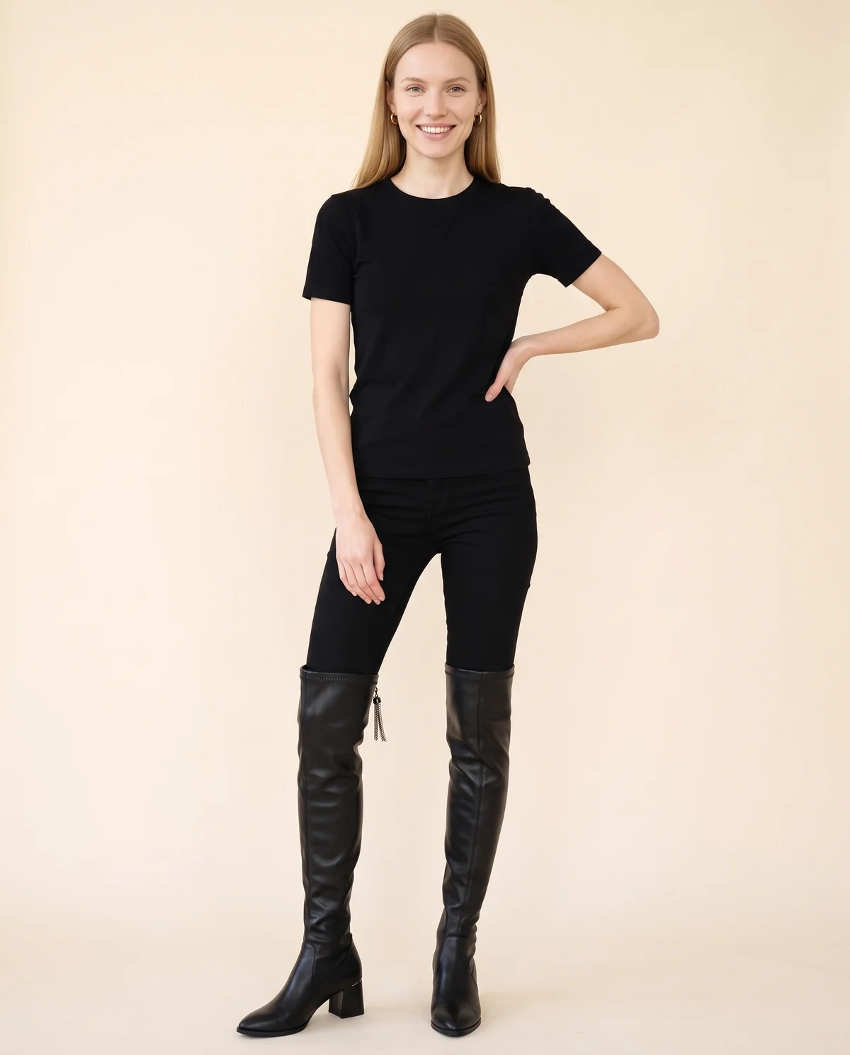 Stretch Over-the-Knee Block-Heel Boot in Black, front view, worn by Maya