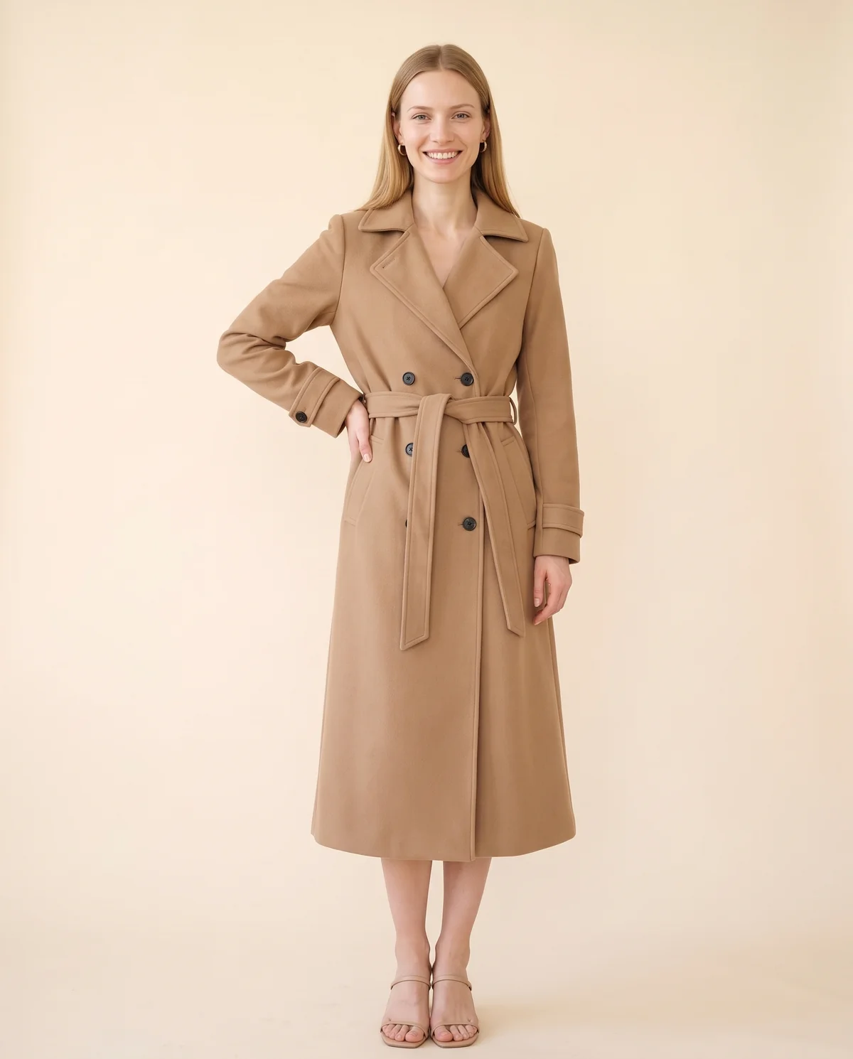 Long Belted Double-Breasted Trench in Camel, front view, worn by Maya